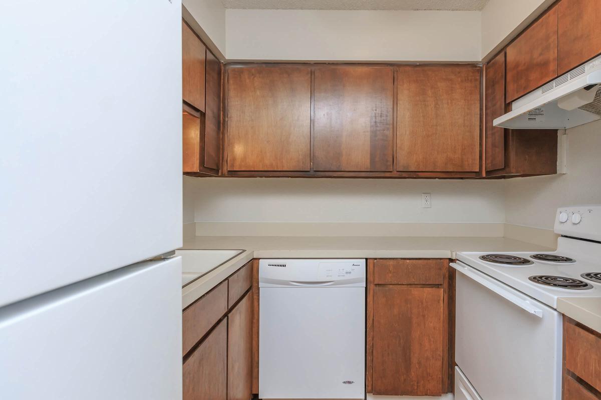 a kitchen with a stove top oven sitting inside of a refrigerator