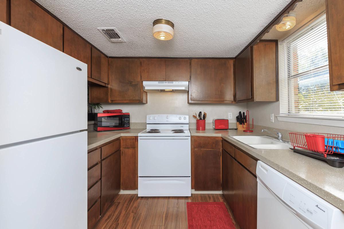 a kitchen with a stove top oven sitting inside of a refrigerator