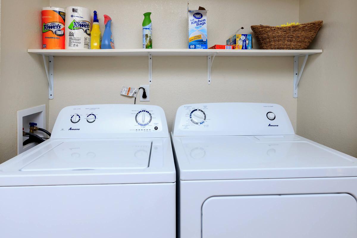 a white stove top oven sitting next to a sink