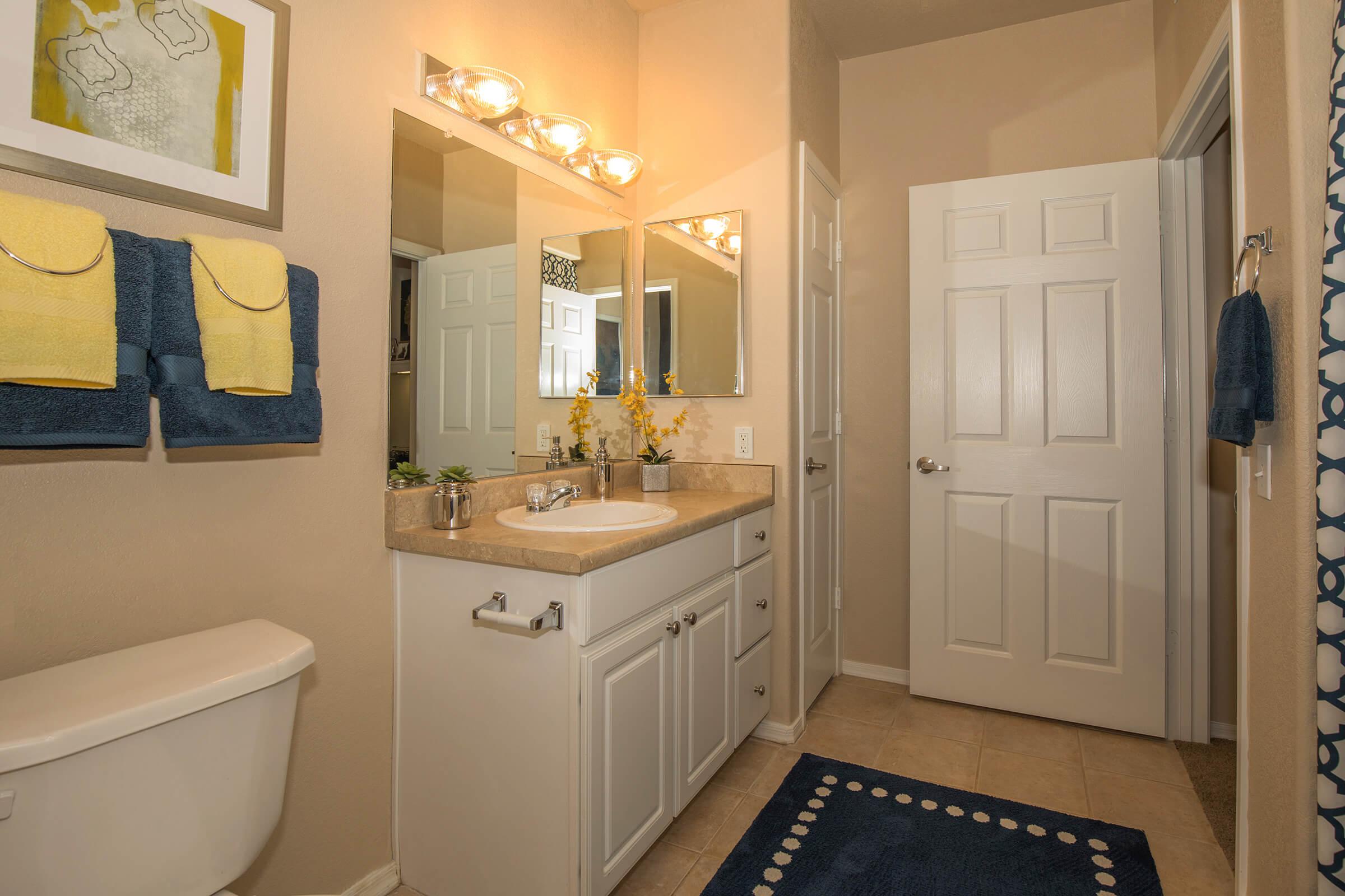 a room with a sink and a mirror