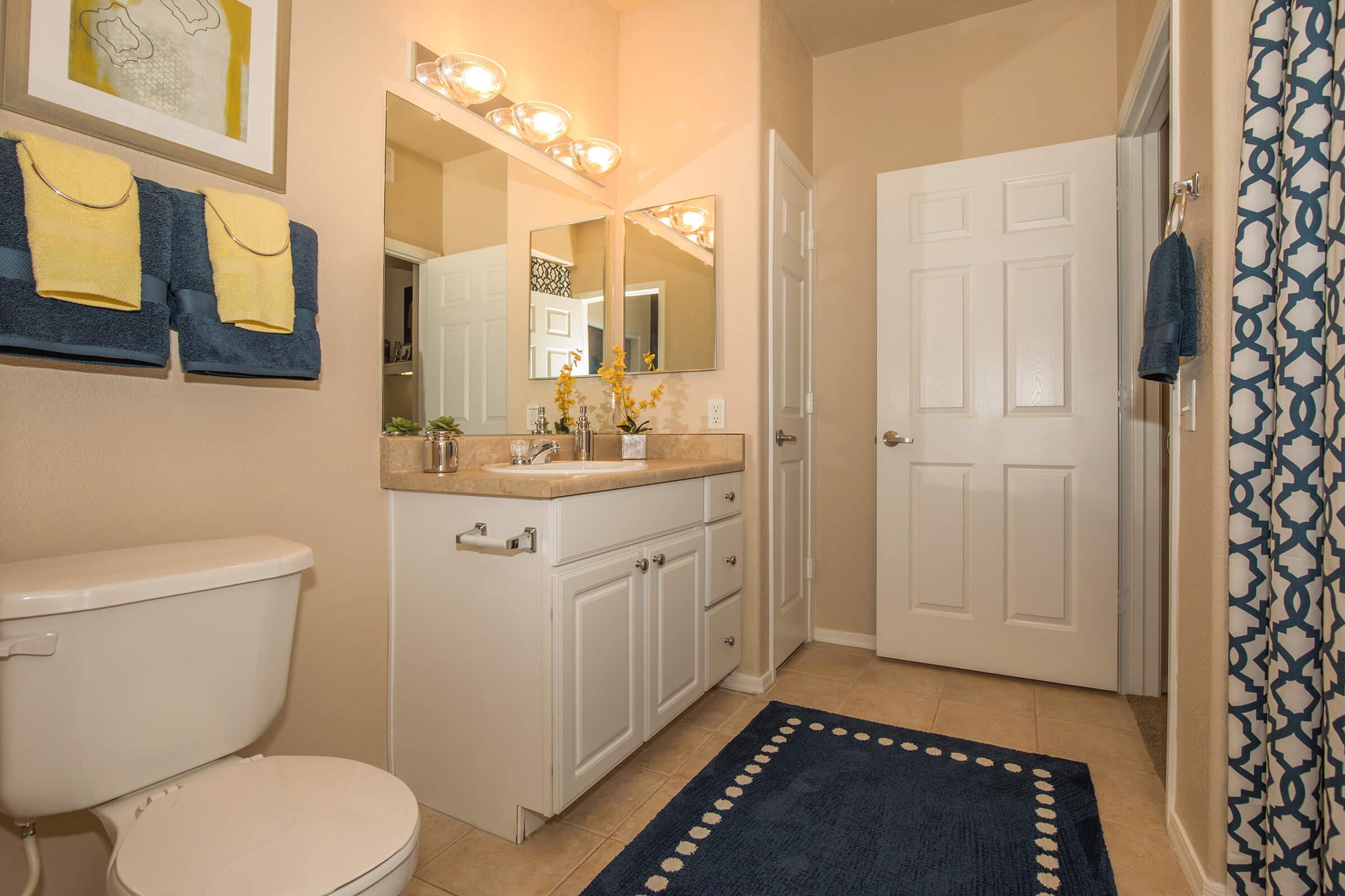 a room with a sink and a mirror
