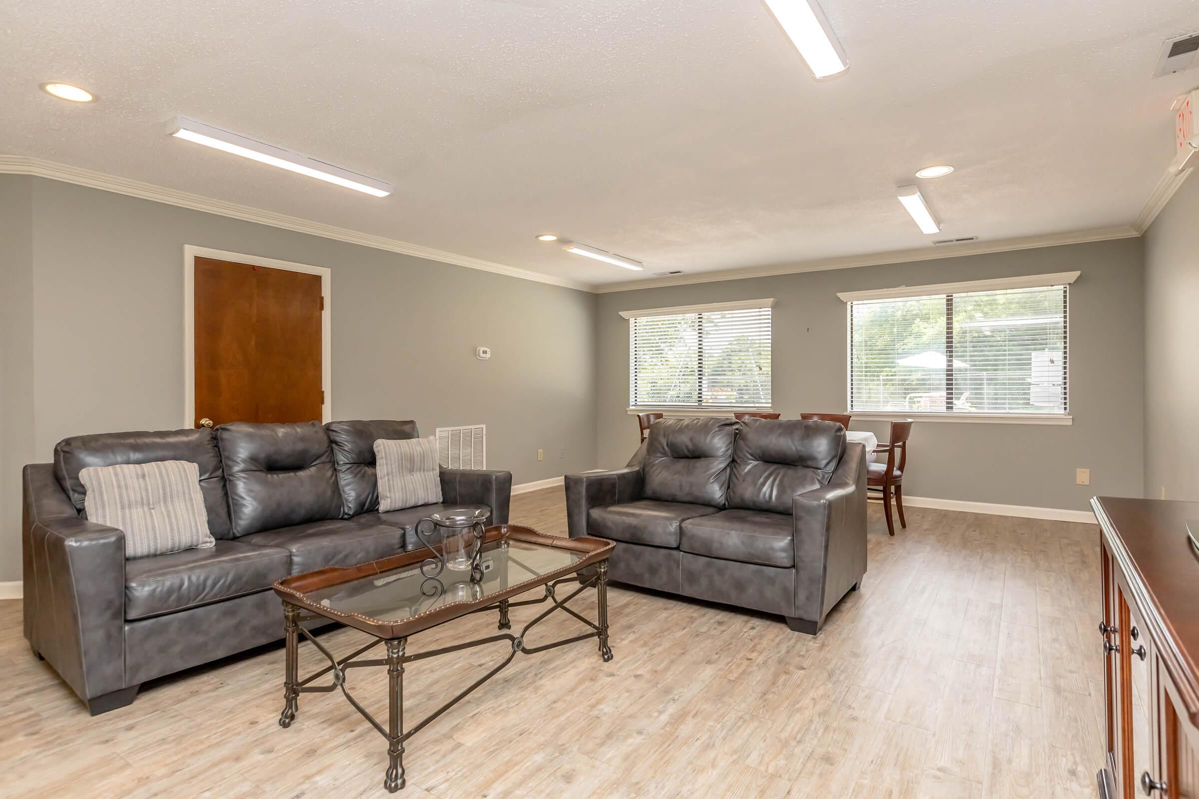 a living room filled with furniture and a fireplace