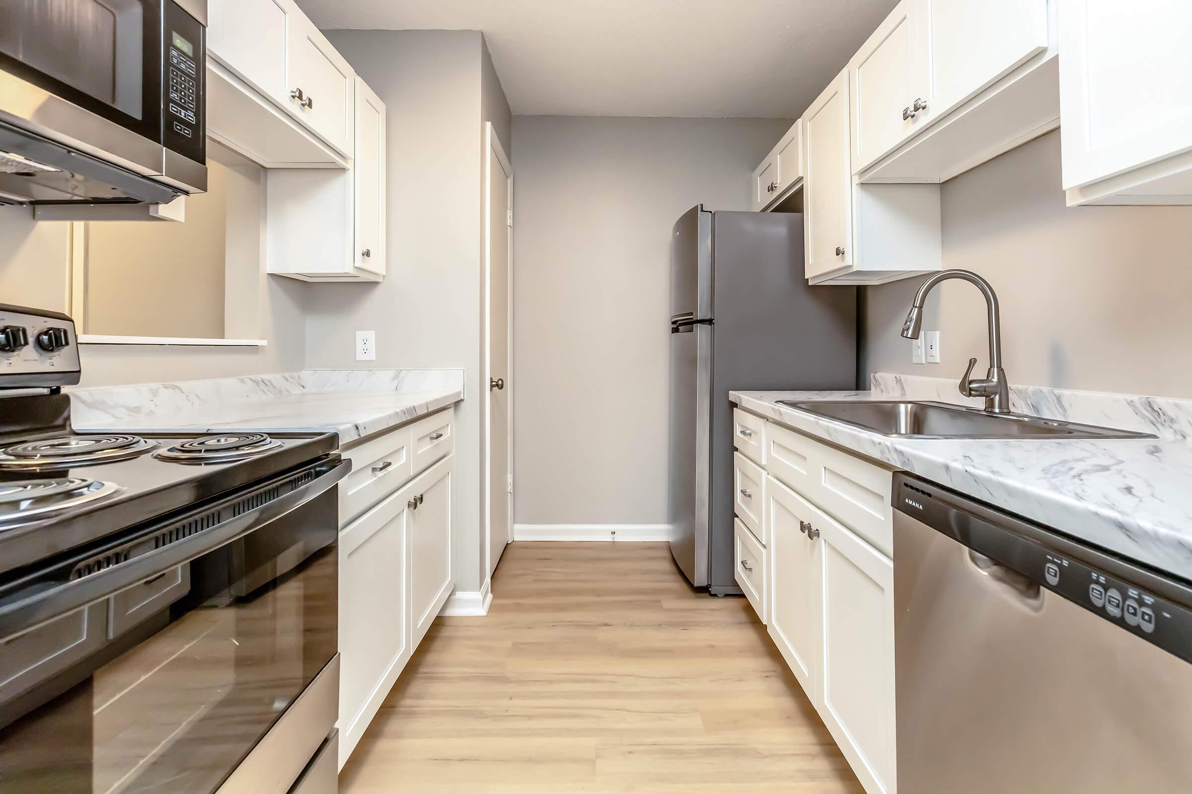 a kitchen with a stove top oven