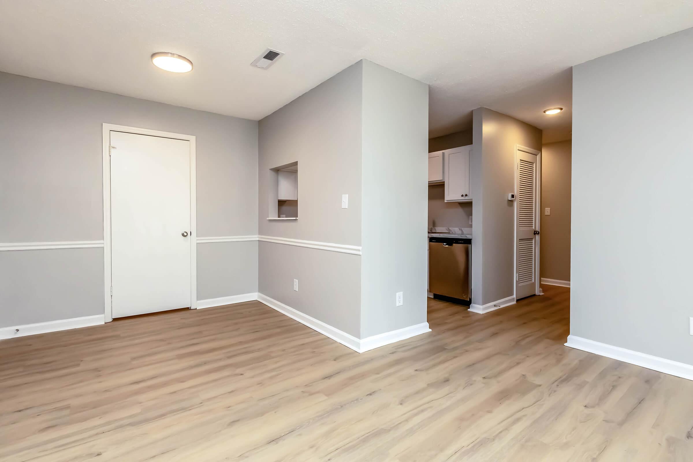 a large empty room with a wood floor