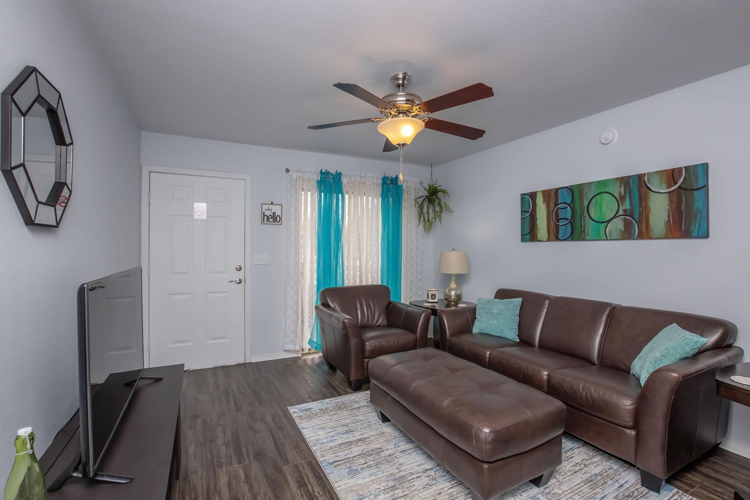 a living room with a leather chair