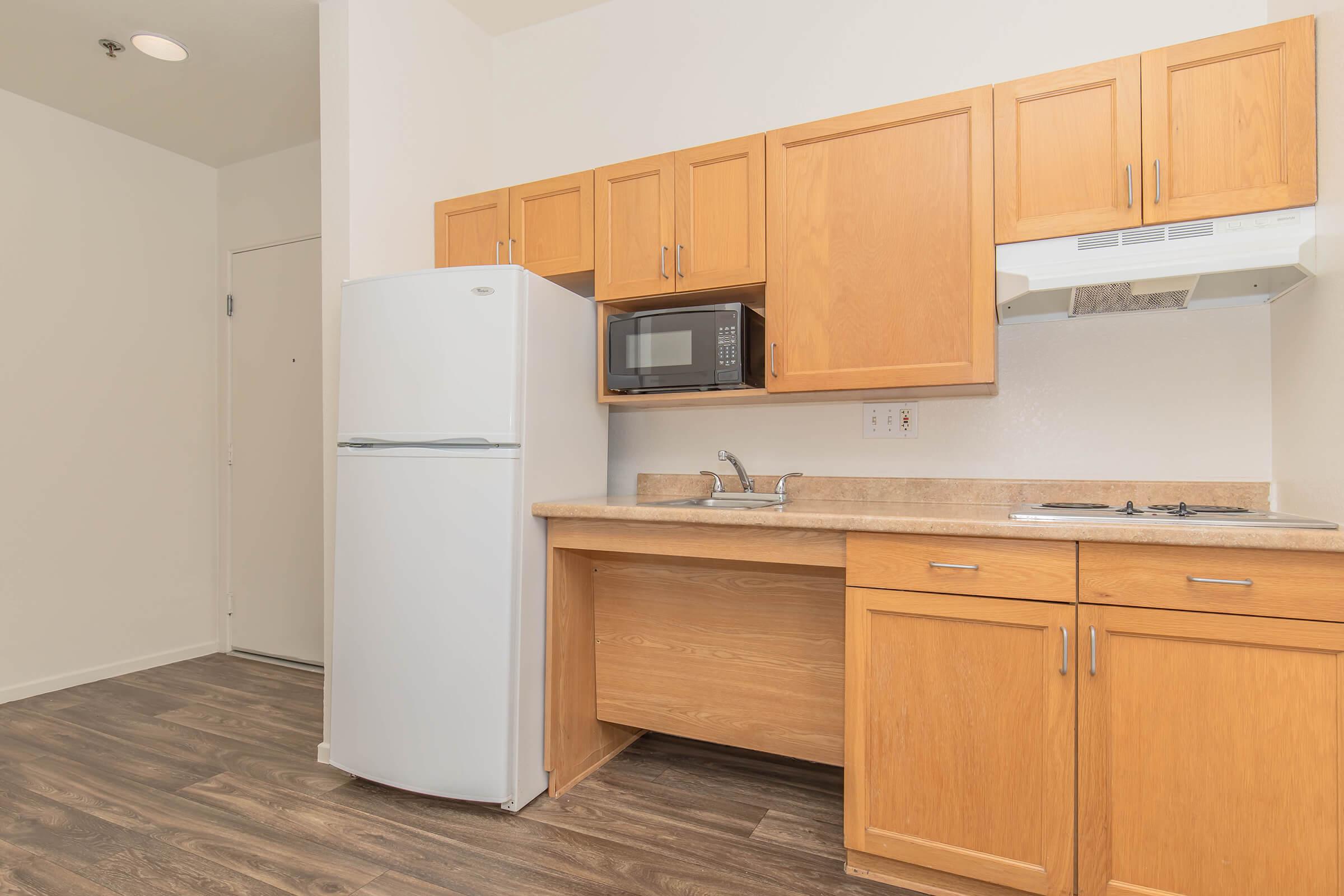 a kitchen with a stove and a refrigerator