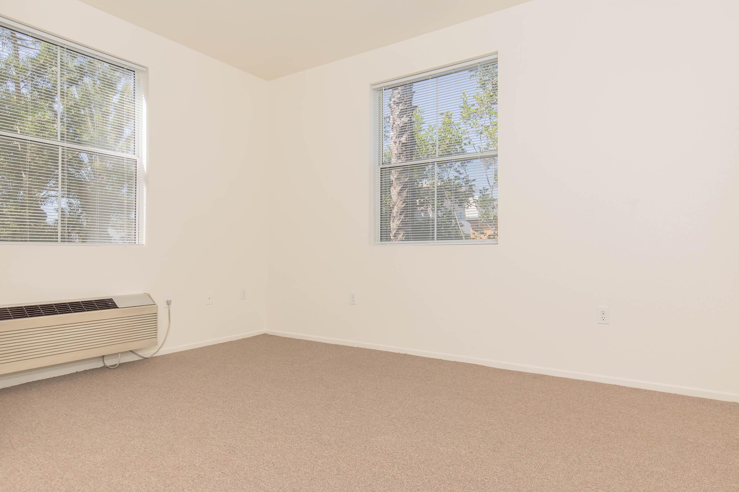 a bedroom with a large window