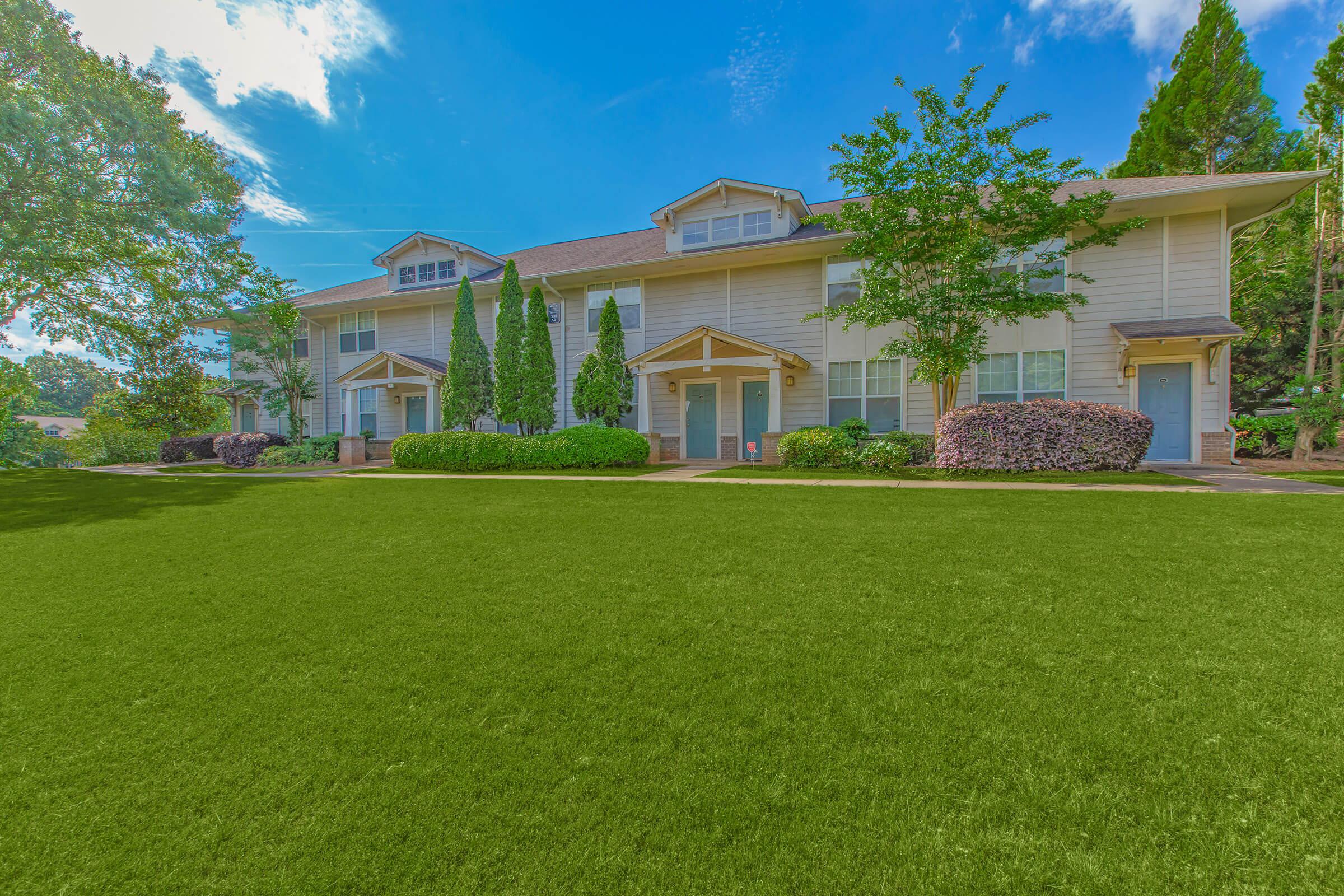 a large lawn in front of a house
