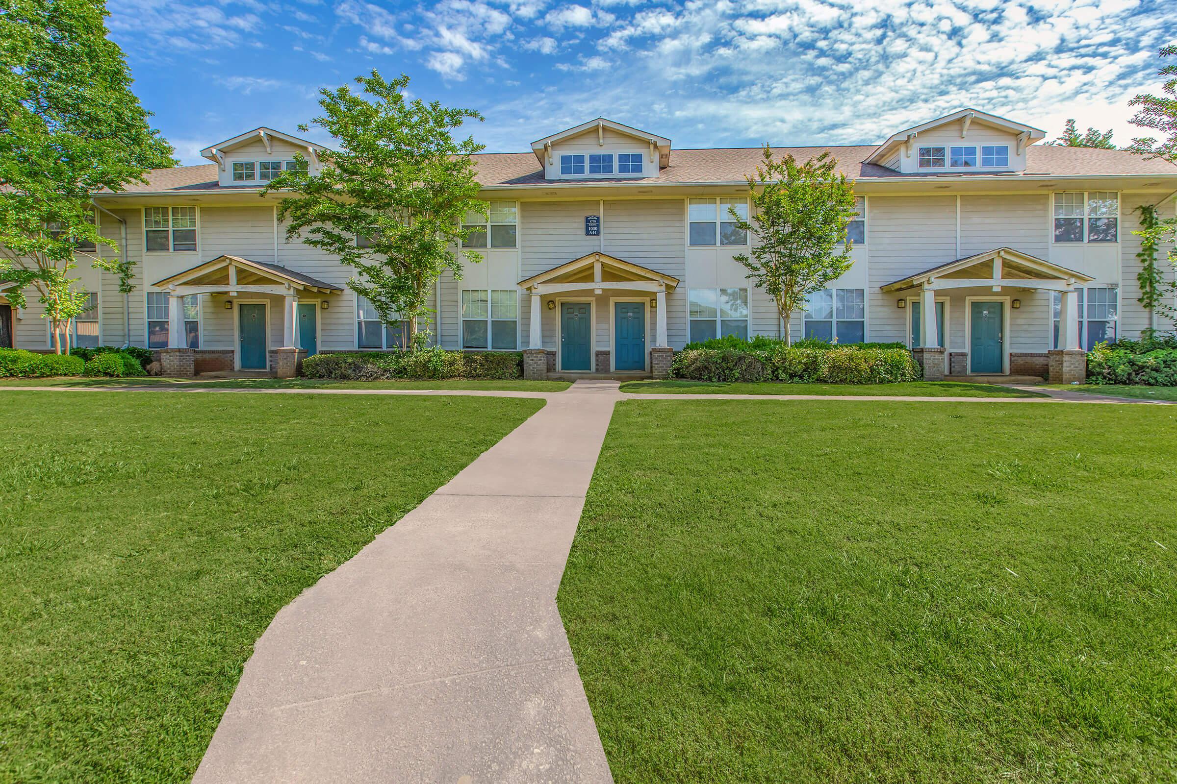 a large lawn in front of a house