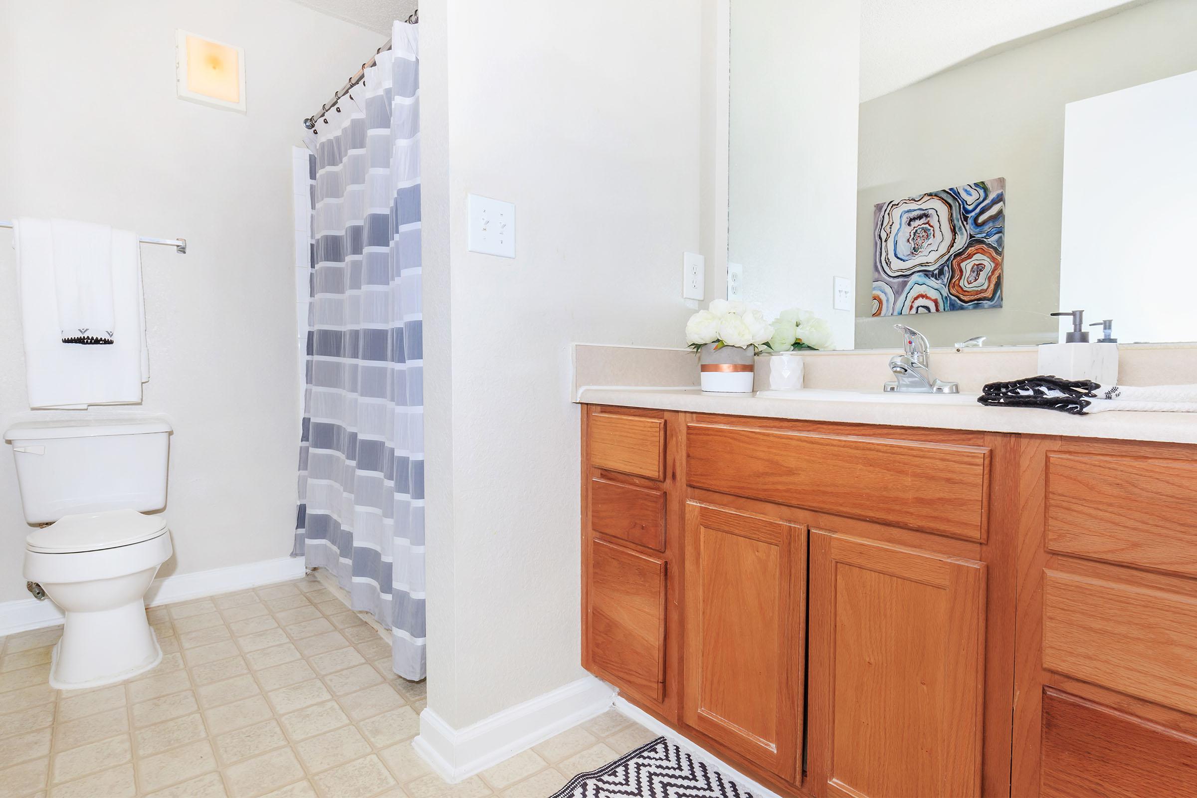 a kitchen with a sink and a mirror
