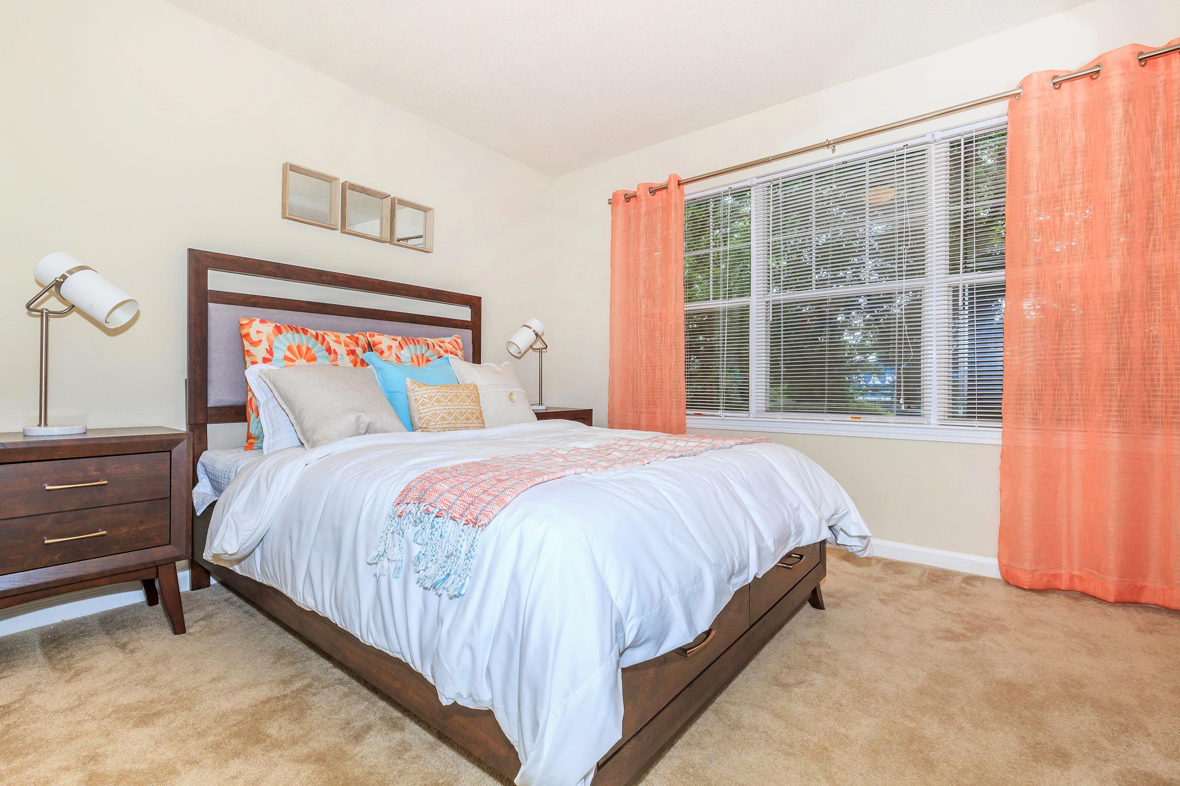 a bedroom with a large bed in a room