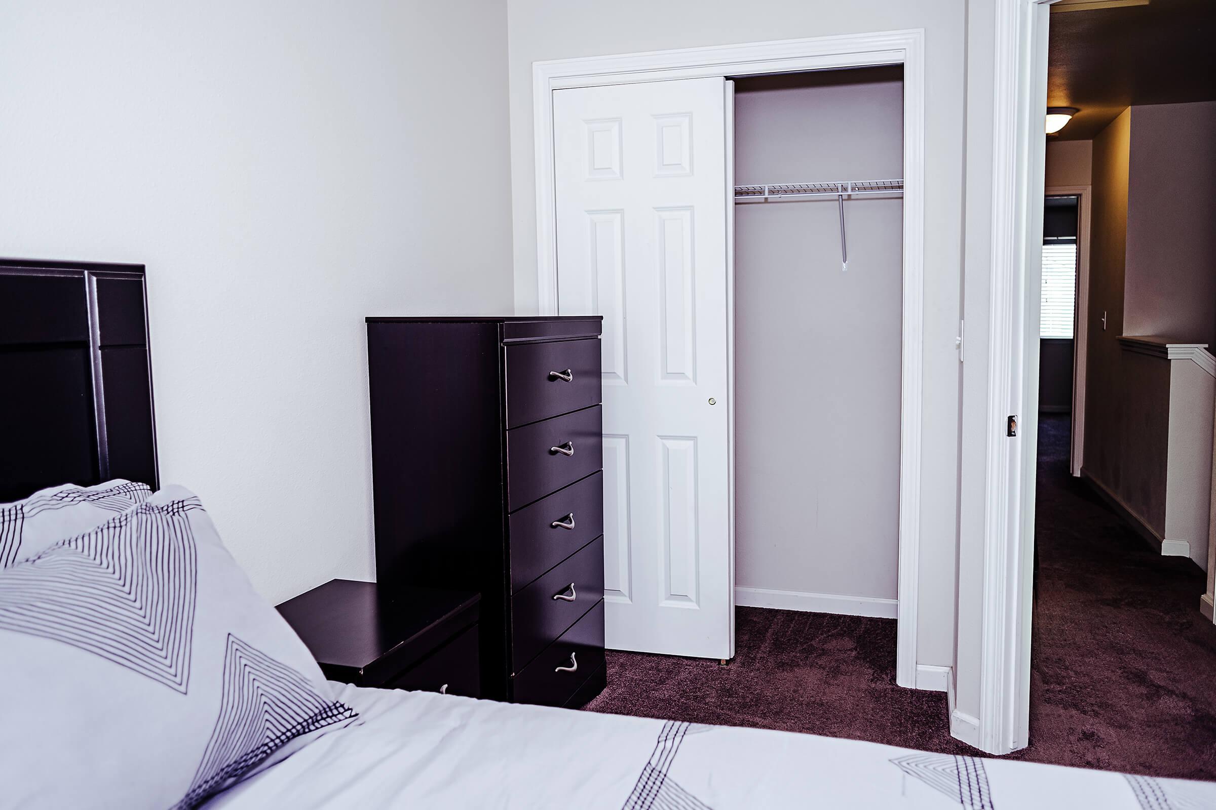 Bedroom with an open closet door