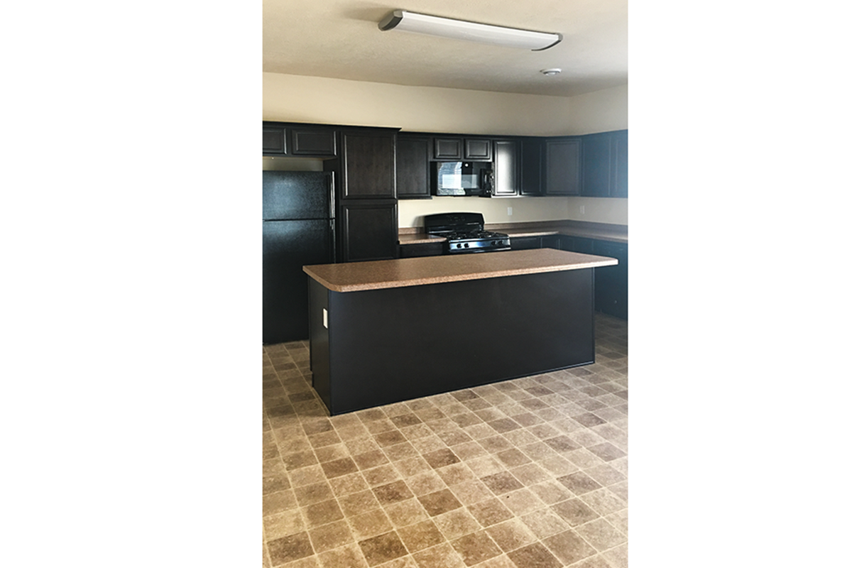 Unfurnished kitchen with tile floors