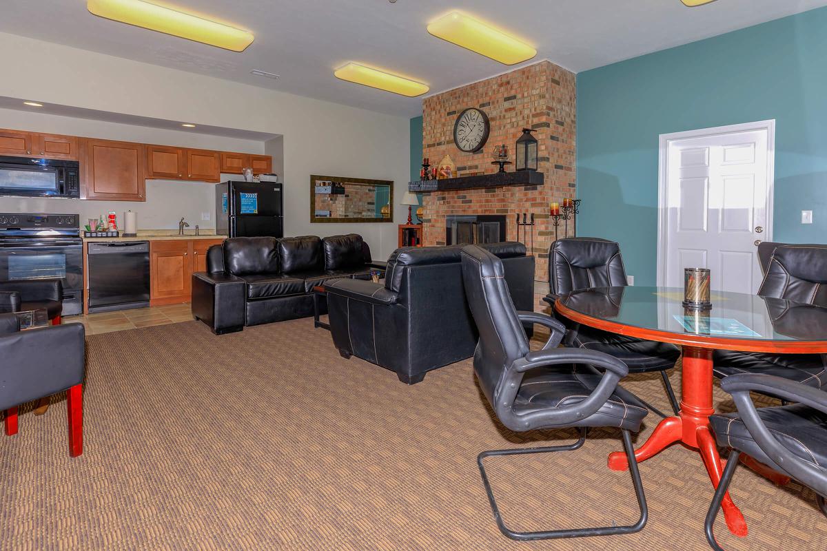 a living room filled with furniture and a tv