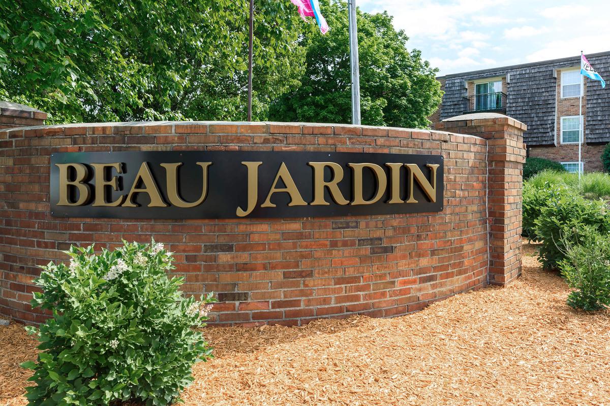 a sign in front of a brick building