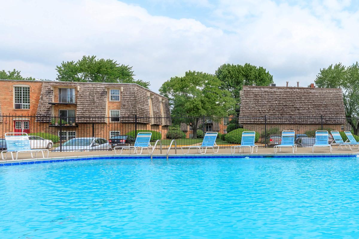 a large pool of water in front of a house