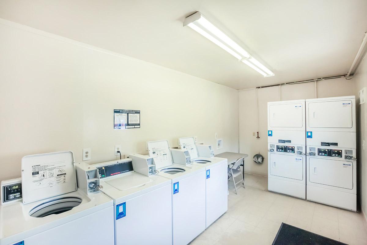 a white refrigerator freezer sitting inside of a kitchen