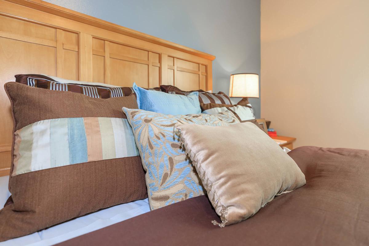 a bedroom with a large bed in a hotel room