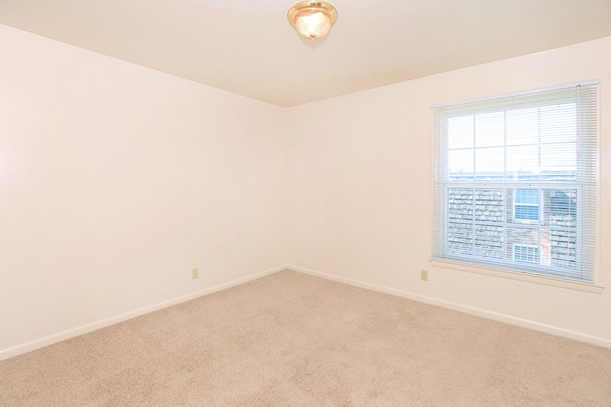 a living room next to a window