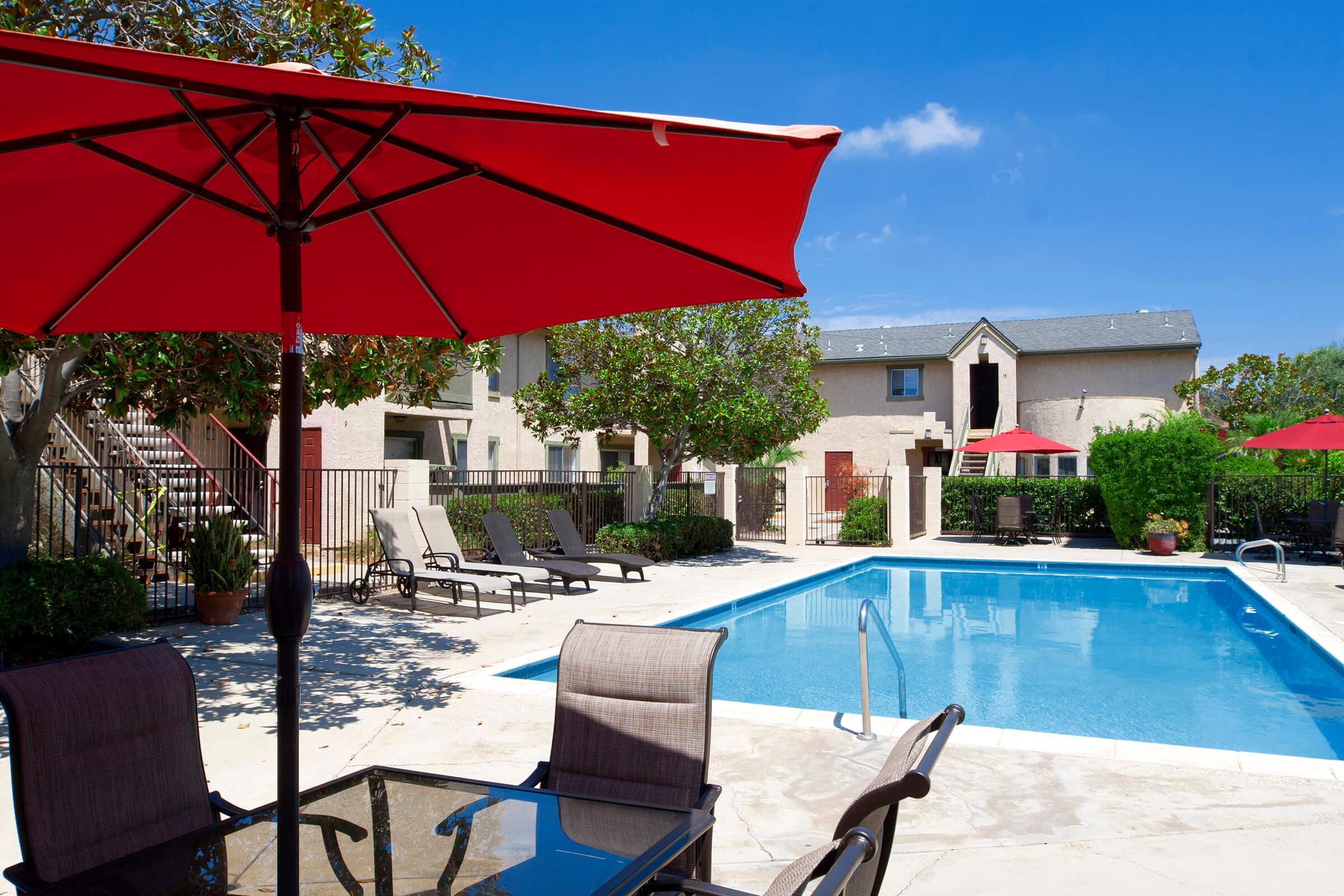 a house with a blue umbrella