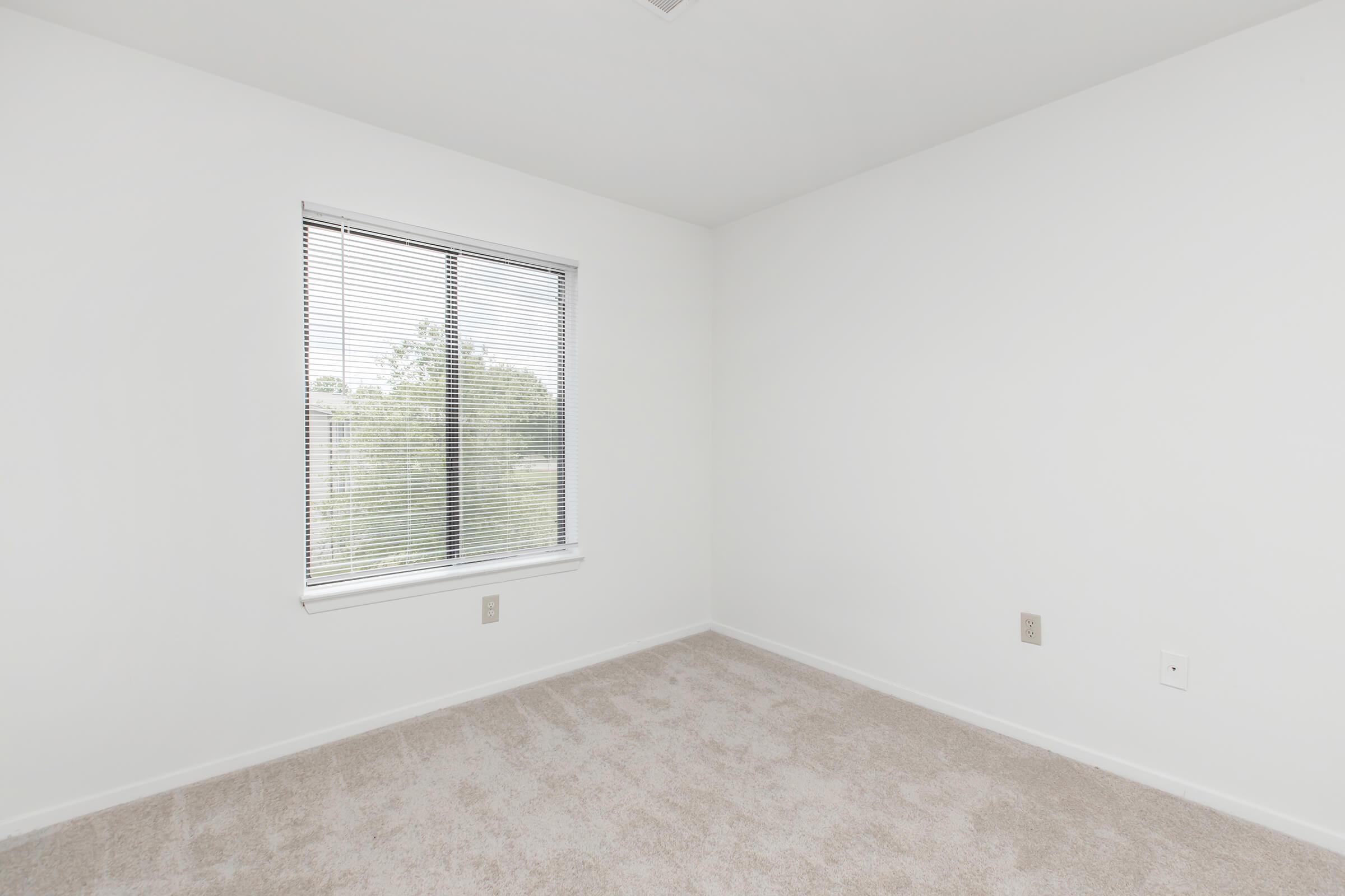 a room with a sink and a window