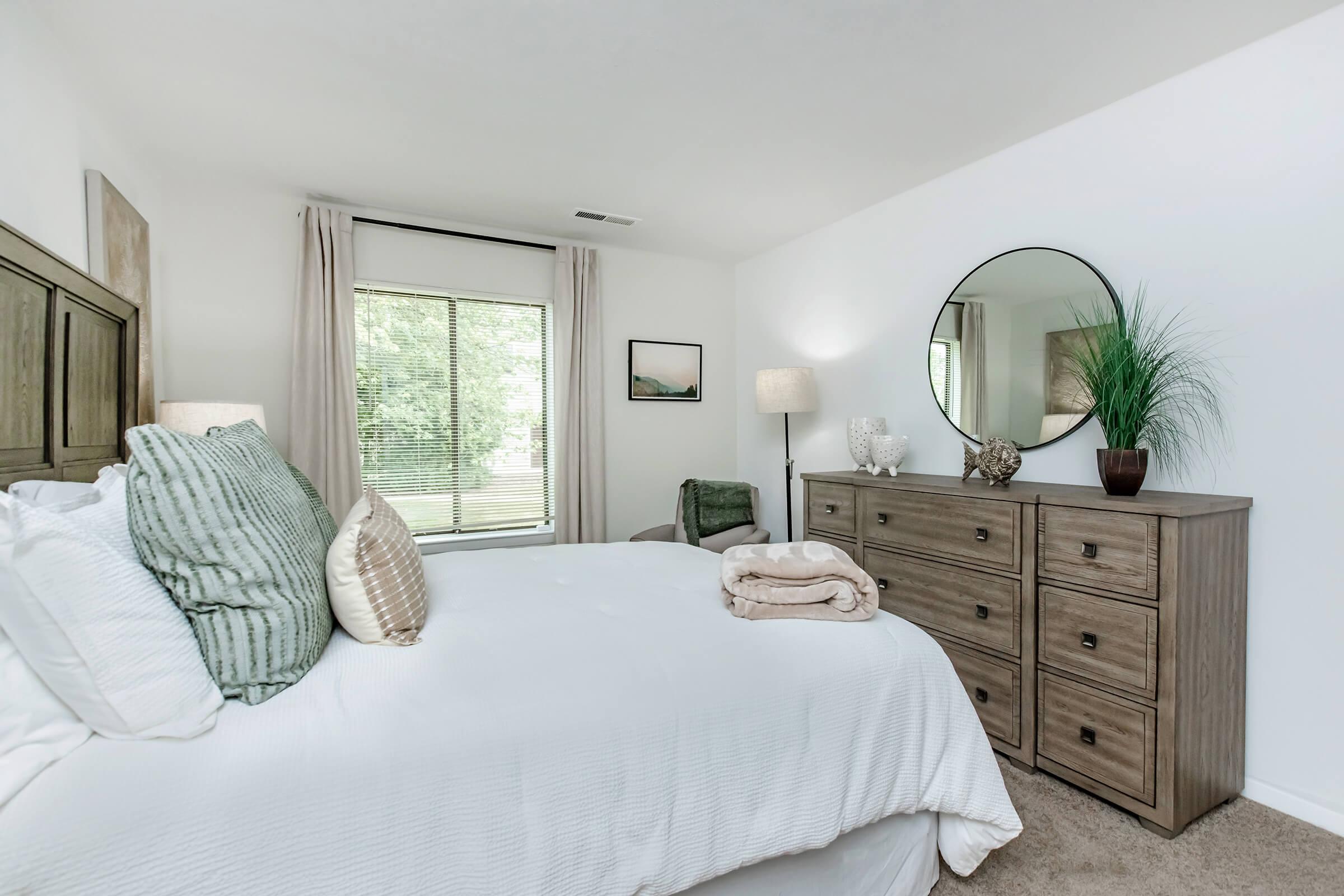 a bedroom with a large bed in a room