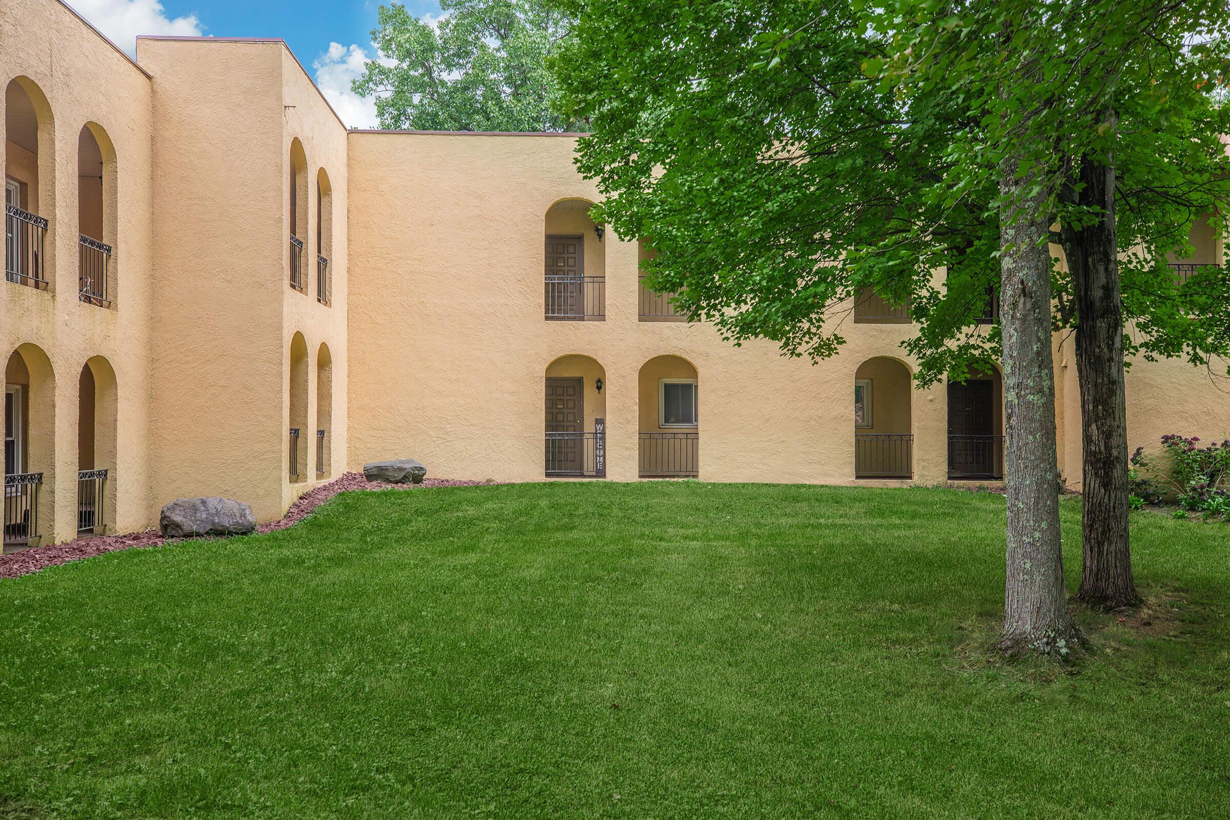 a large lawn in front of a building