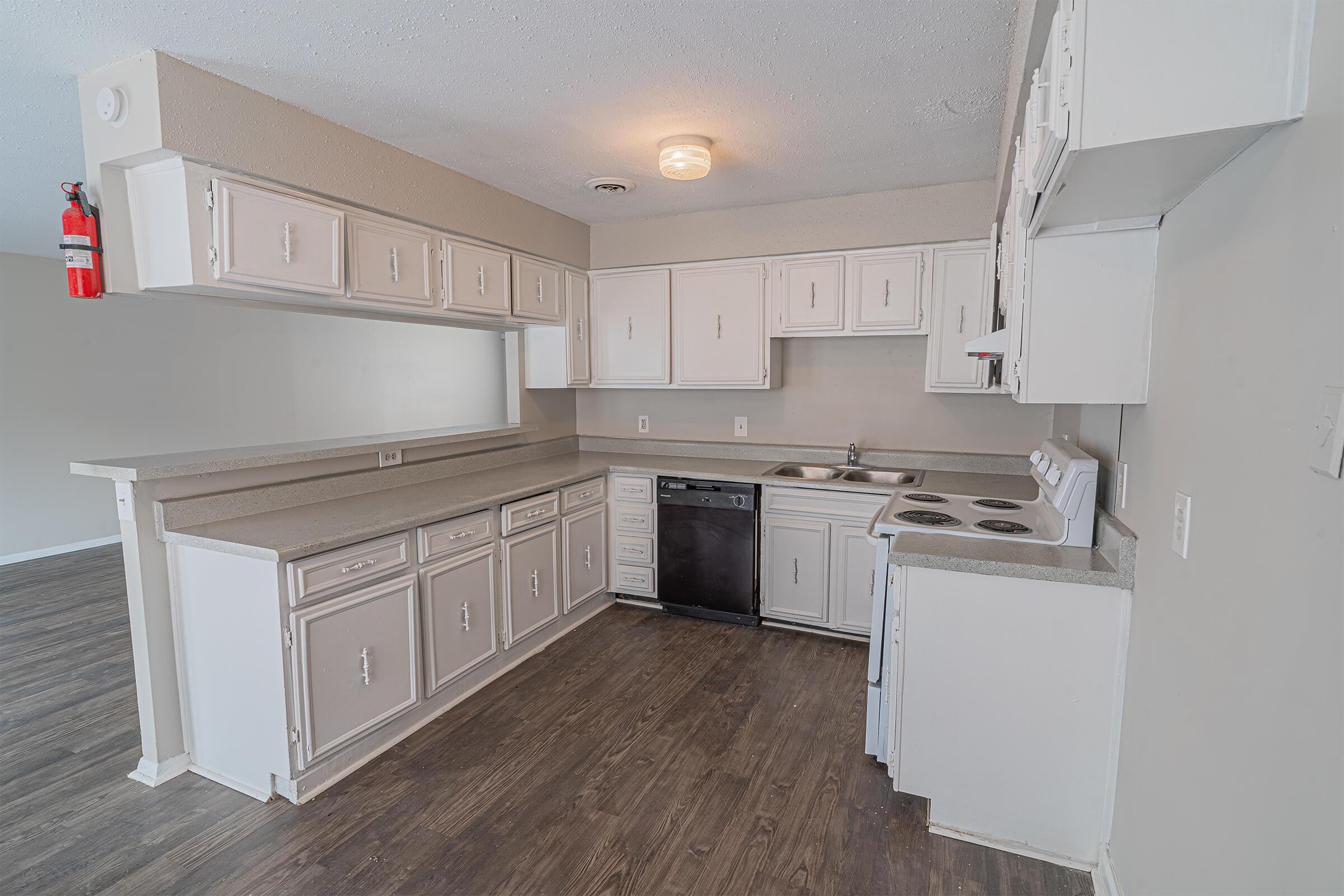 a kitchen with a sink and a refrigerator