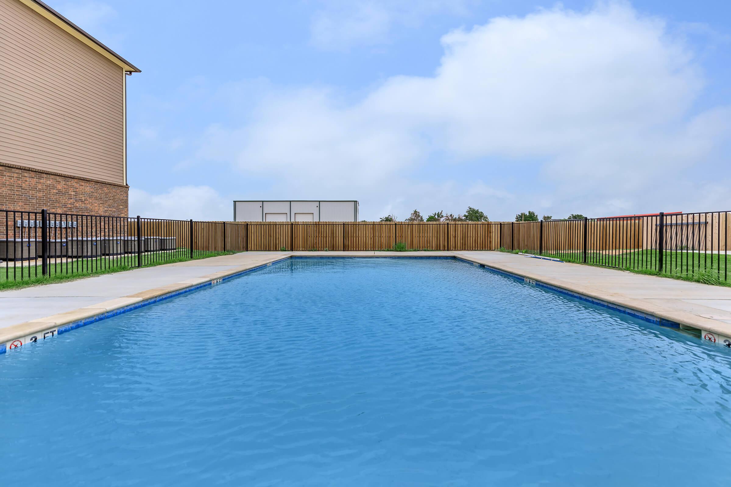 a pool next to a body of water
