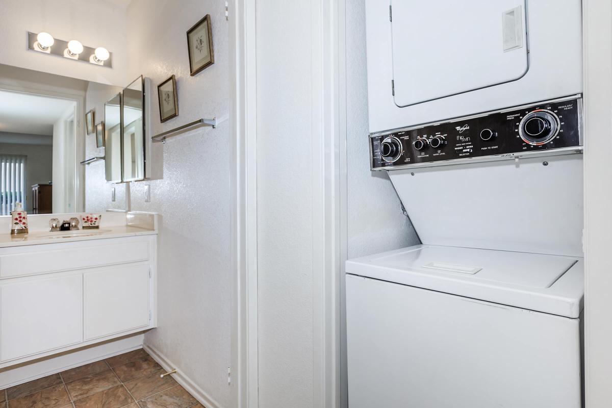 a white refrigerator freezer sitting inside of a kitchen