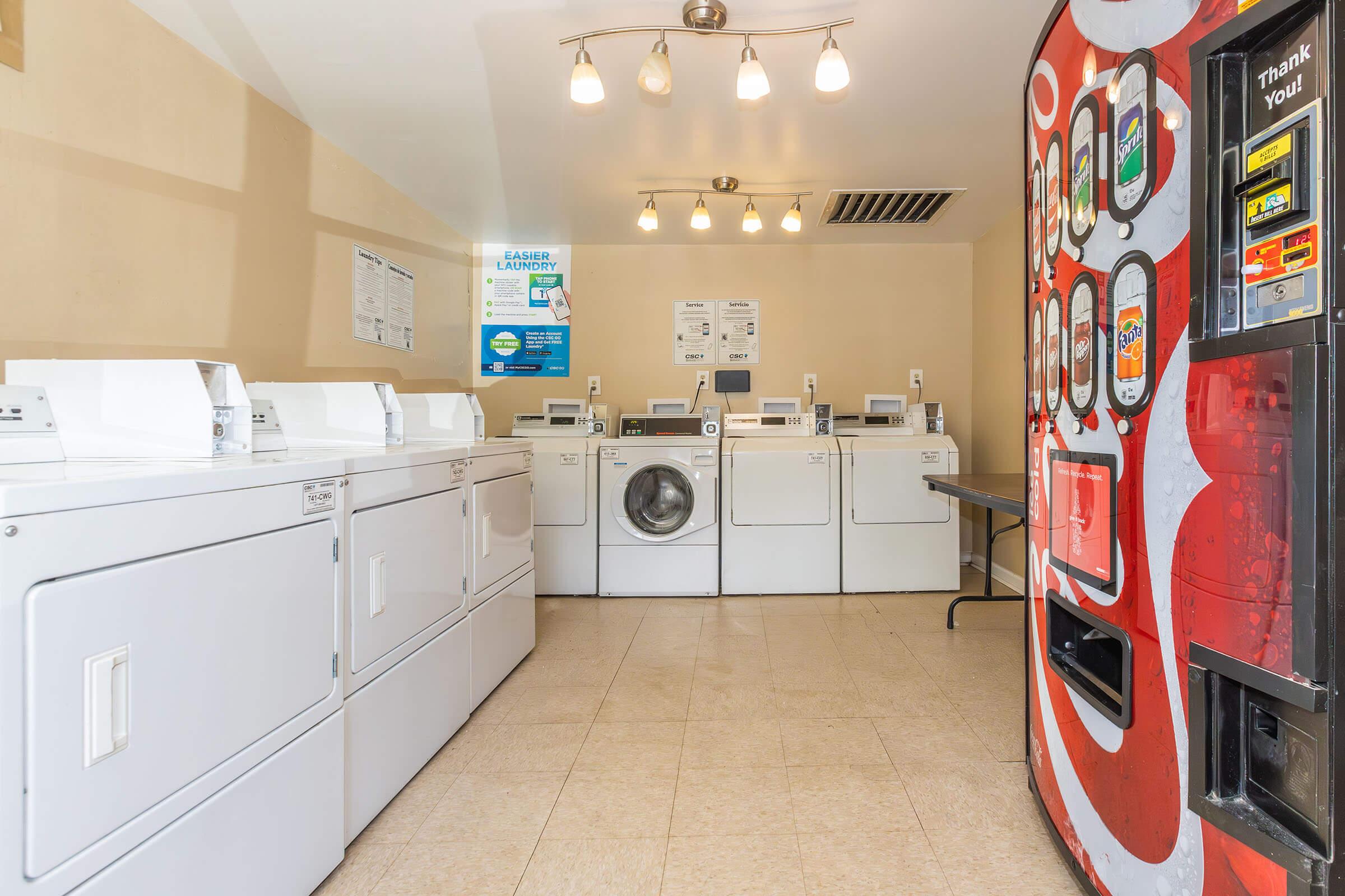 a kitchen with a sink and a refrigerator