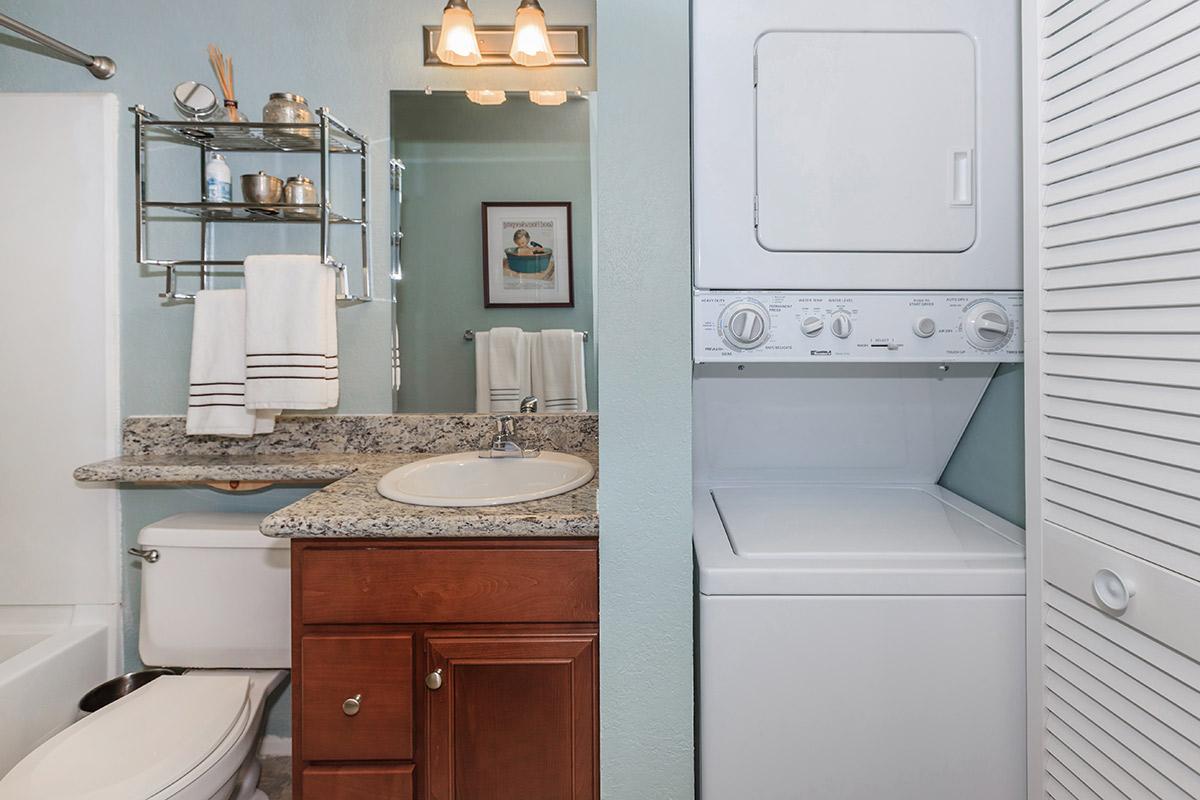 a kitchen with a sink and a microwave