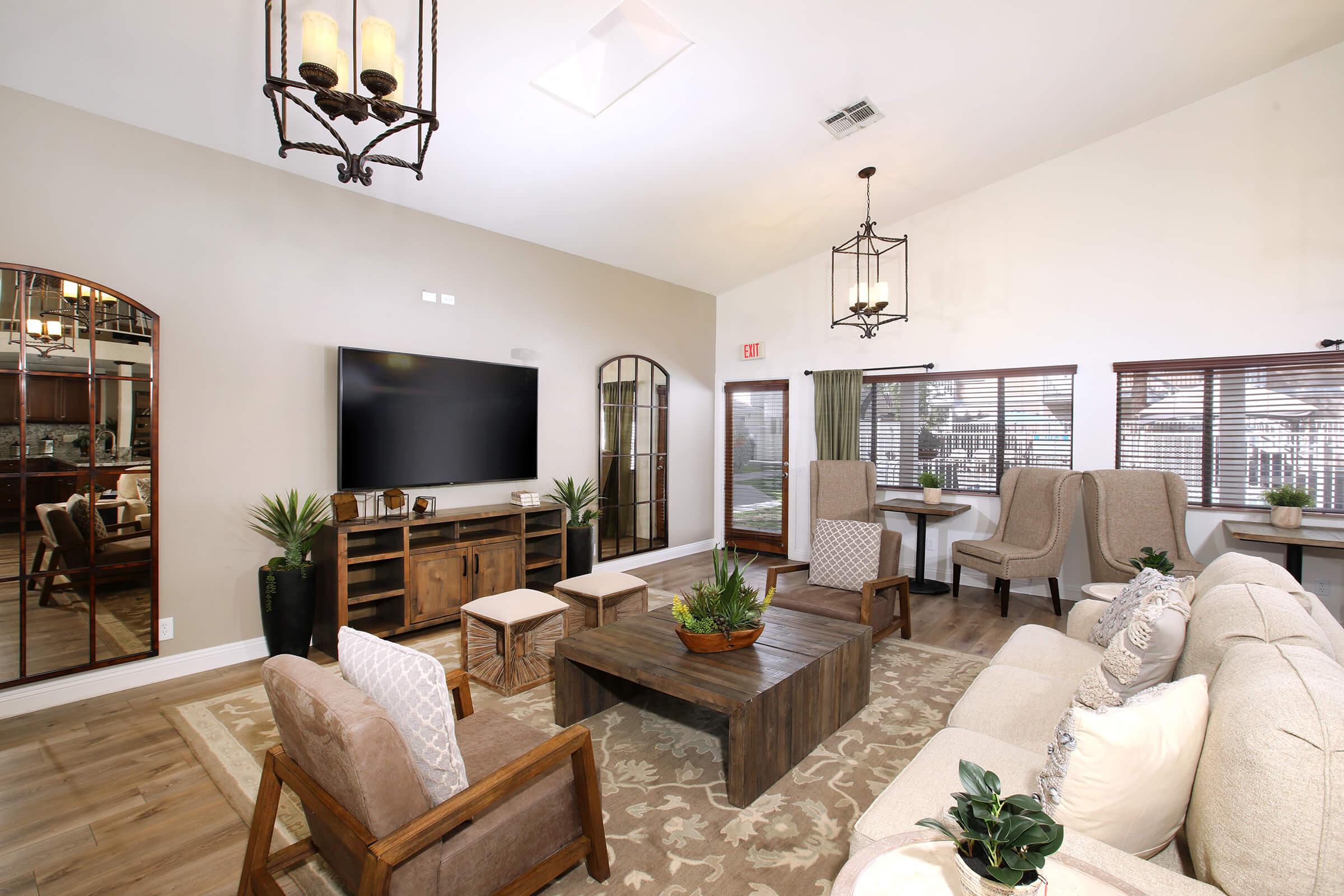 a living room filled with furniture and a fire place