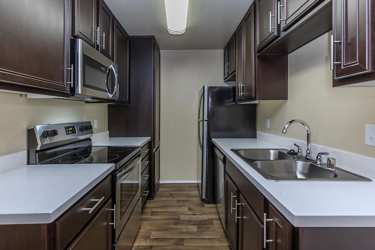 a kitchen with a stainless steel sink