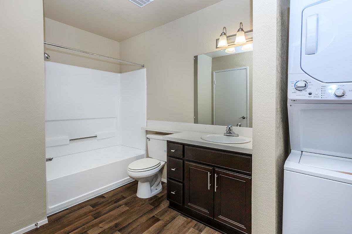 a white refrigerator freezer sitting next to a sink