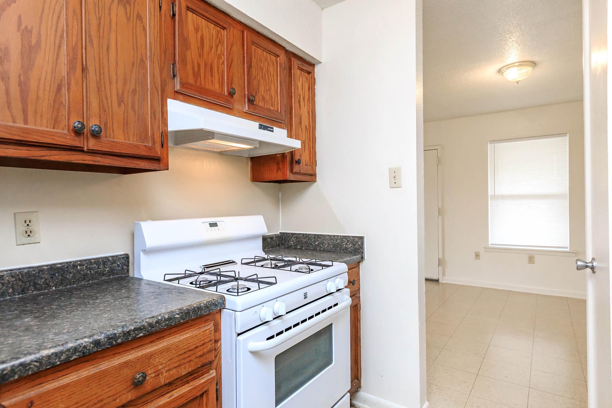 a kitchen with a stove top oven