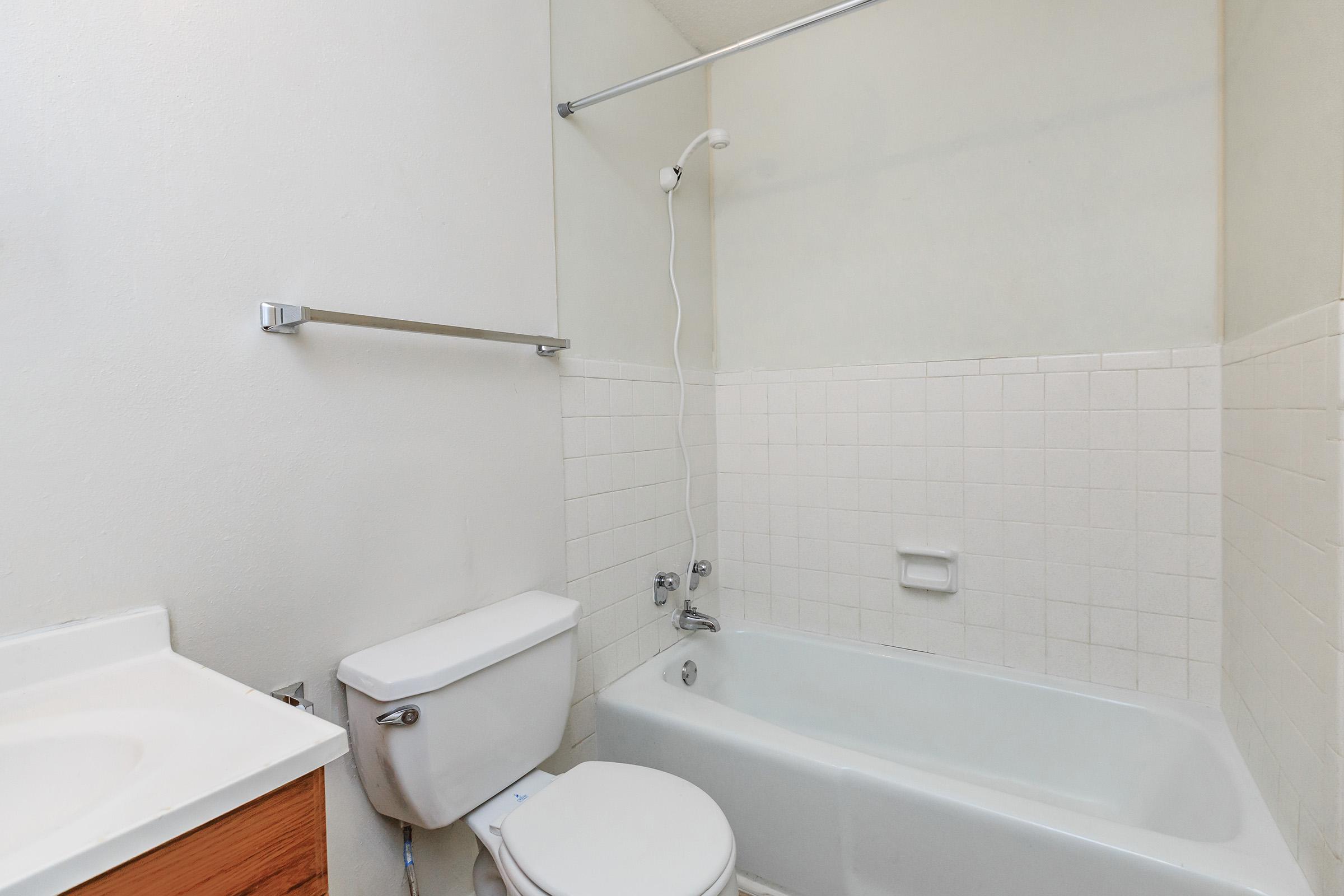 a close up of a sink and a bath tub