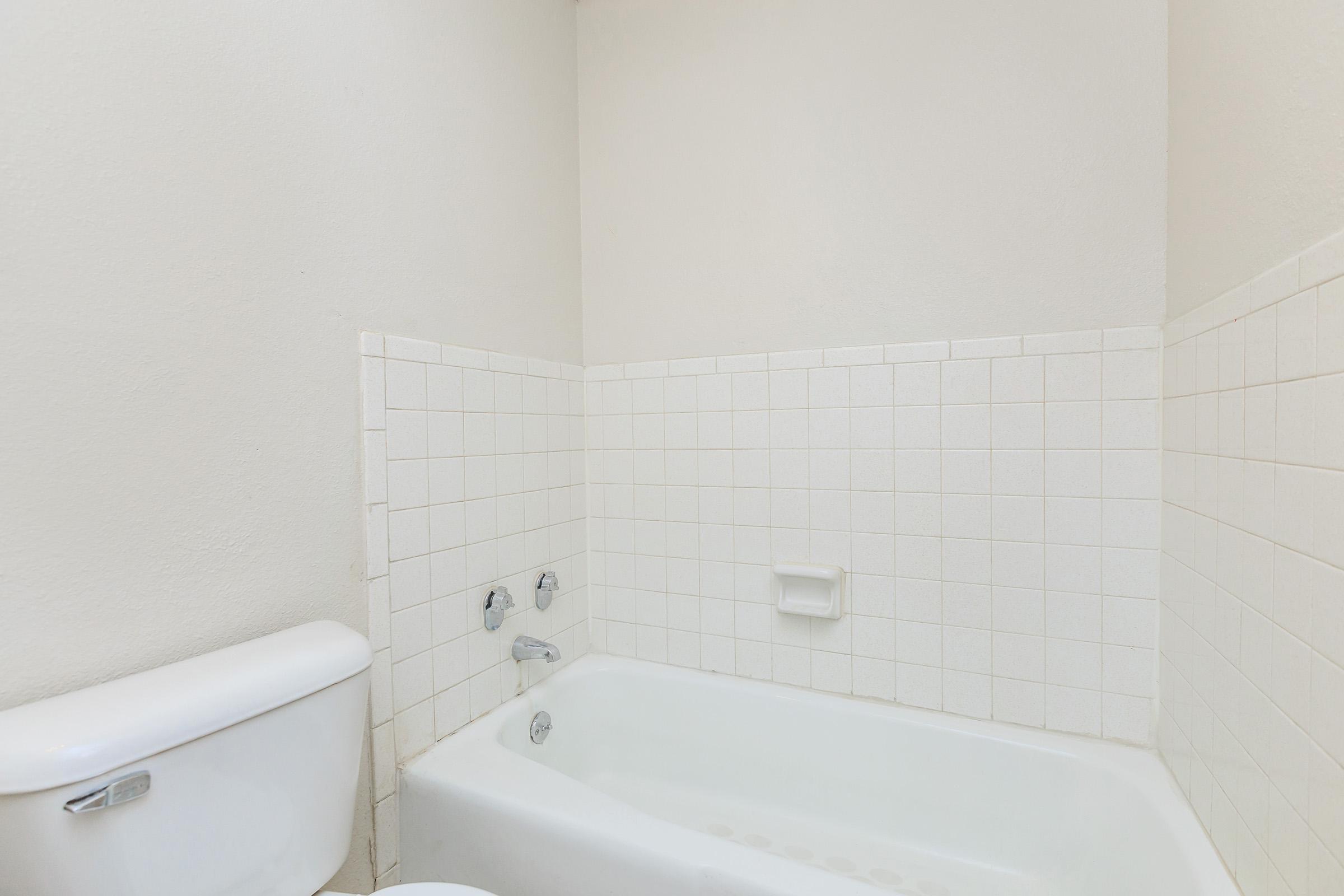 a close up of a sink and a bath tub