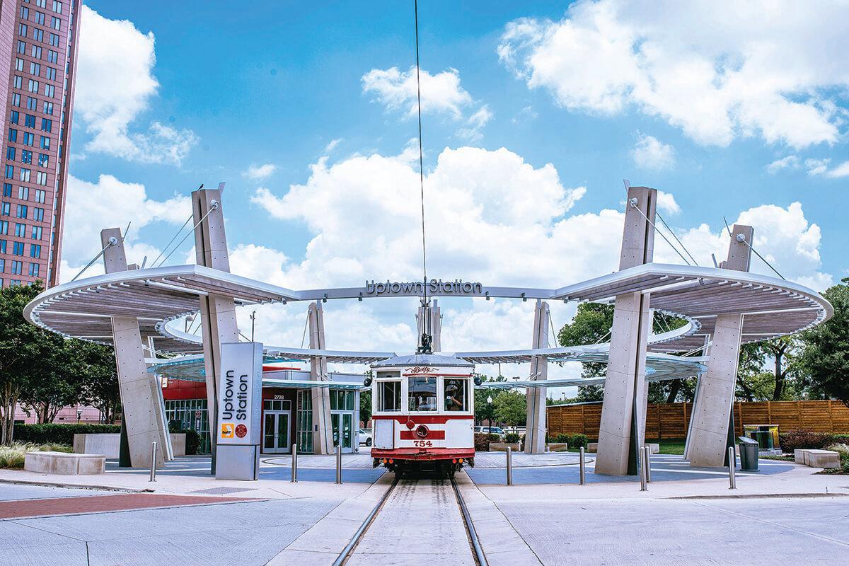 a train is parked on the side of a building