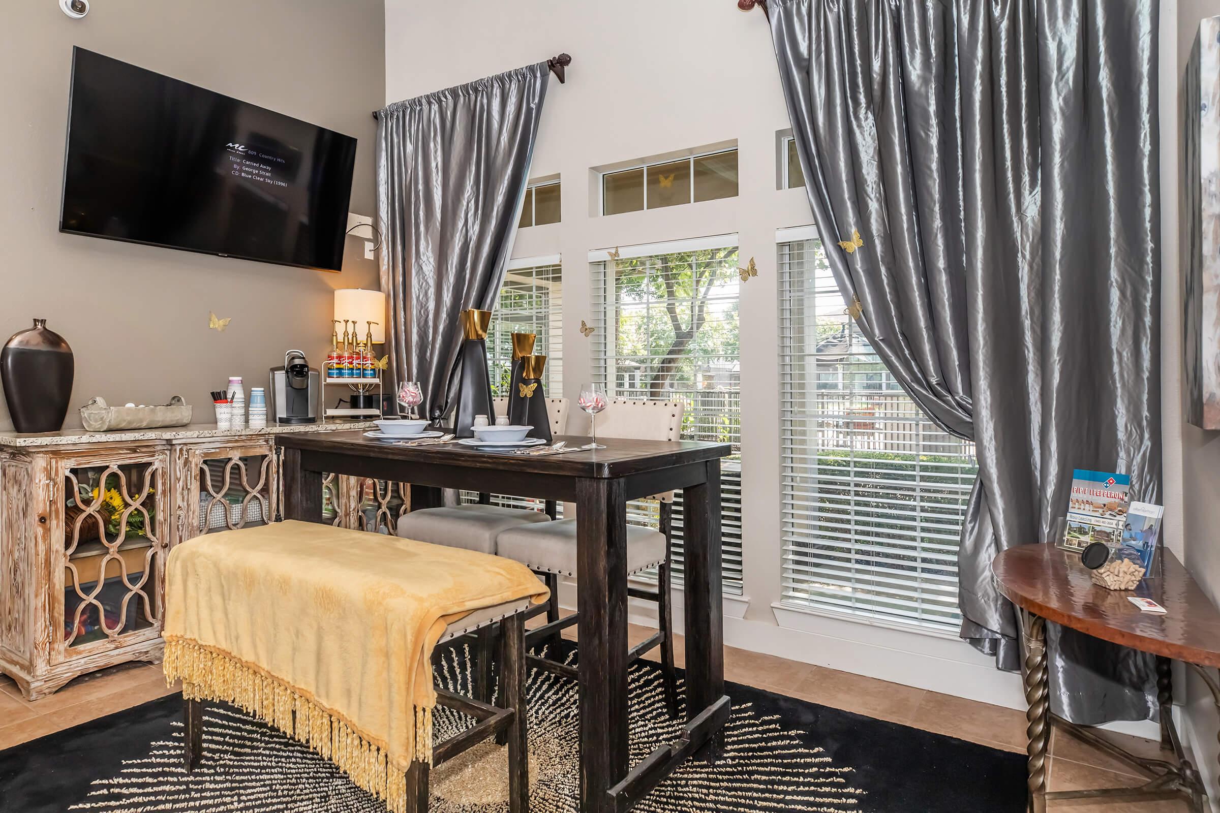 a bedroom with a desk and chair in a room