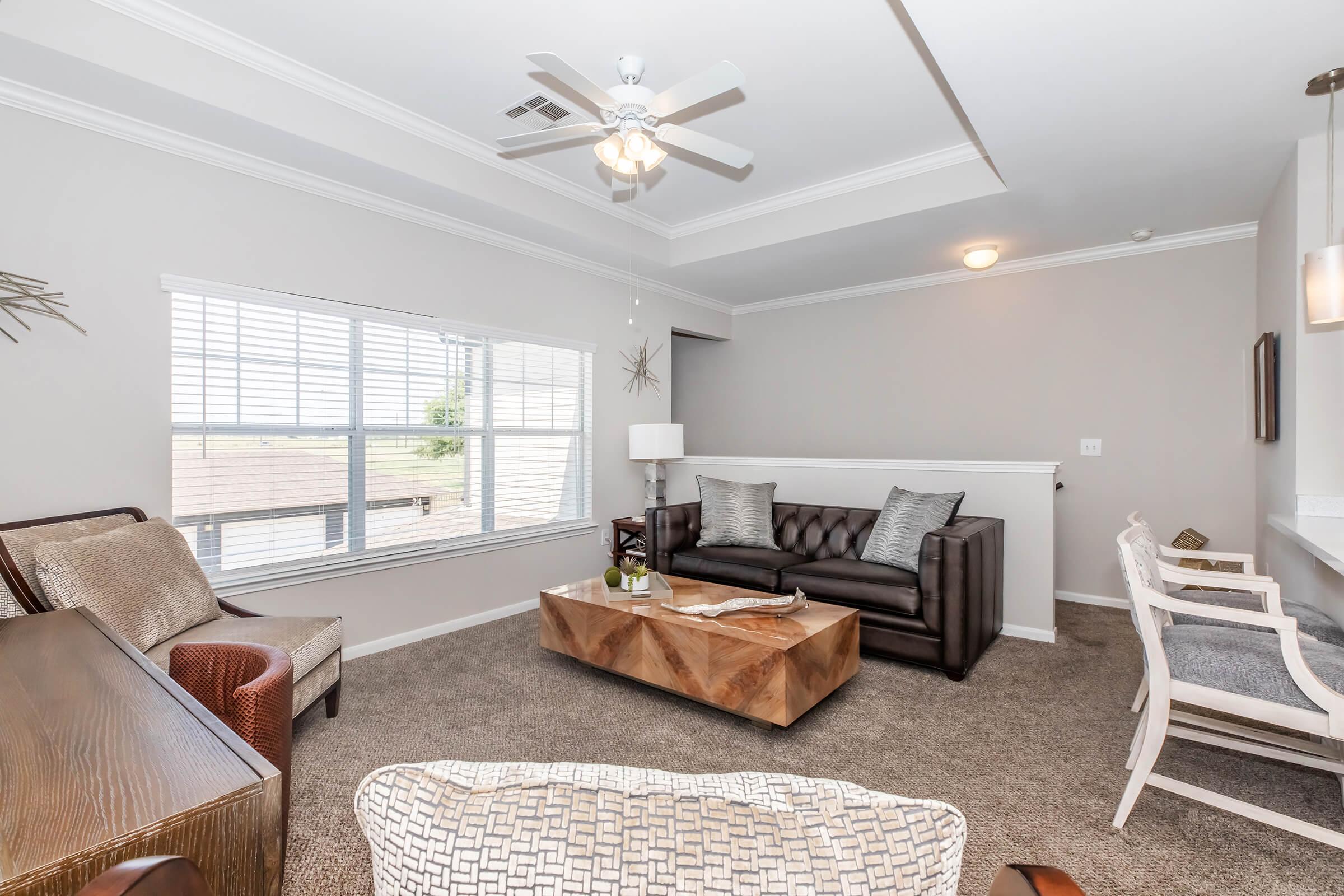 a living room filled with furniture and a fireplace