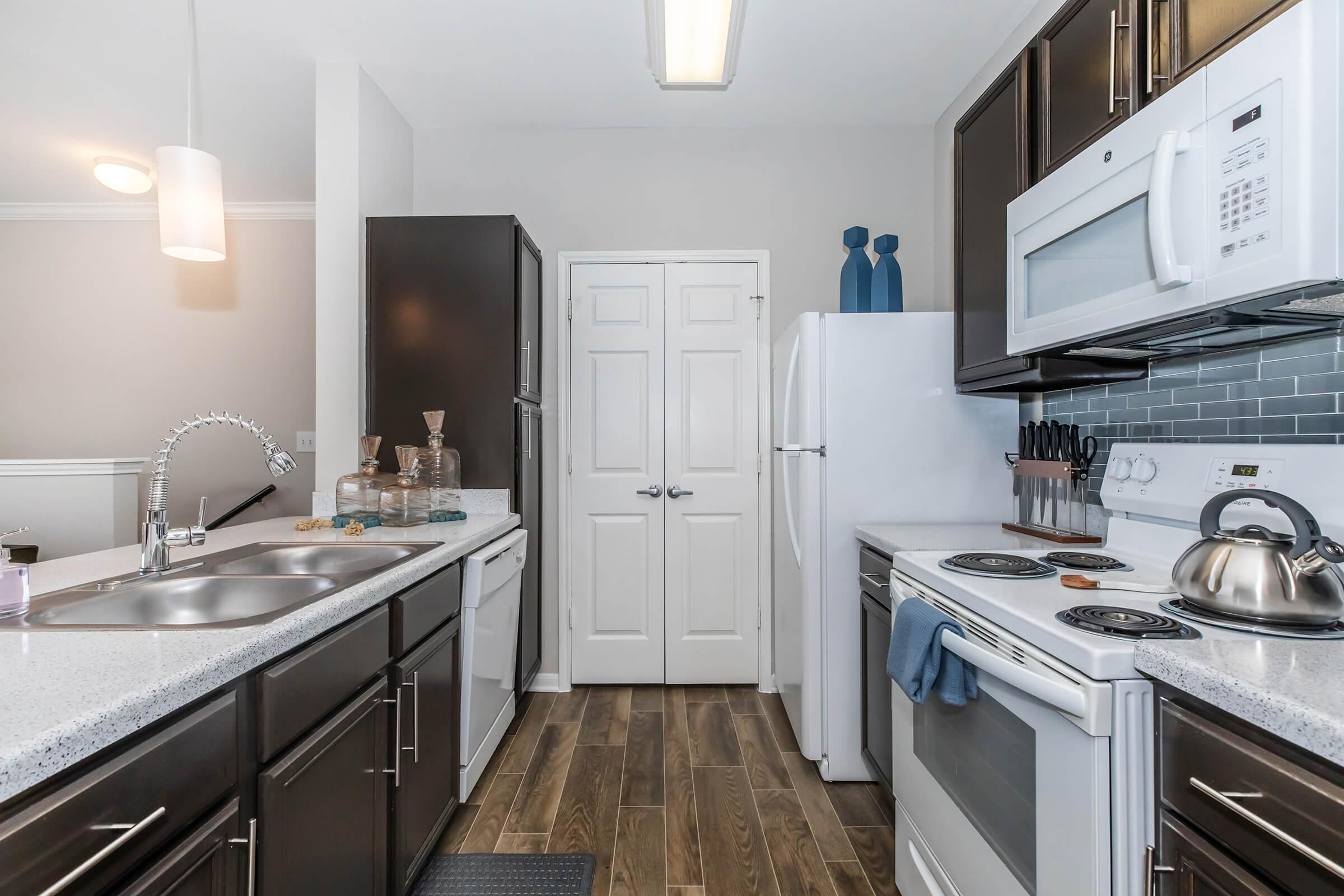 a kitchen with a stove and a sink