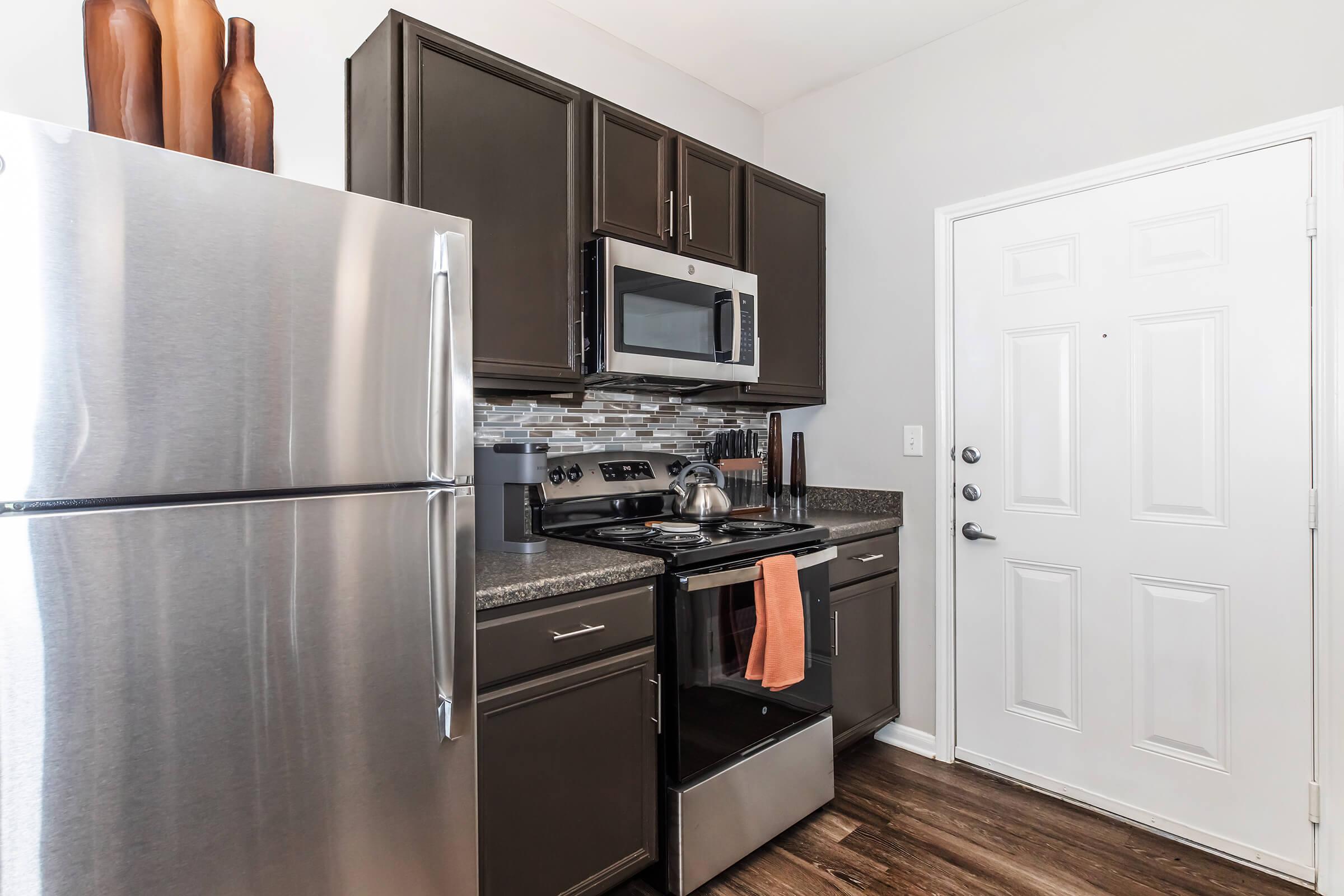 a stainless steel refrigerator in a kitchen