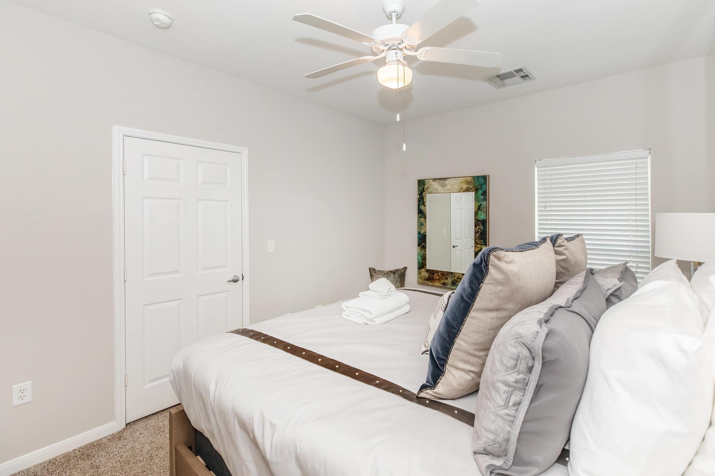 a bedroom with a large bed in a room