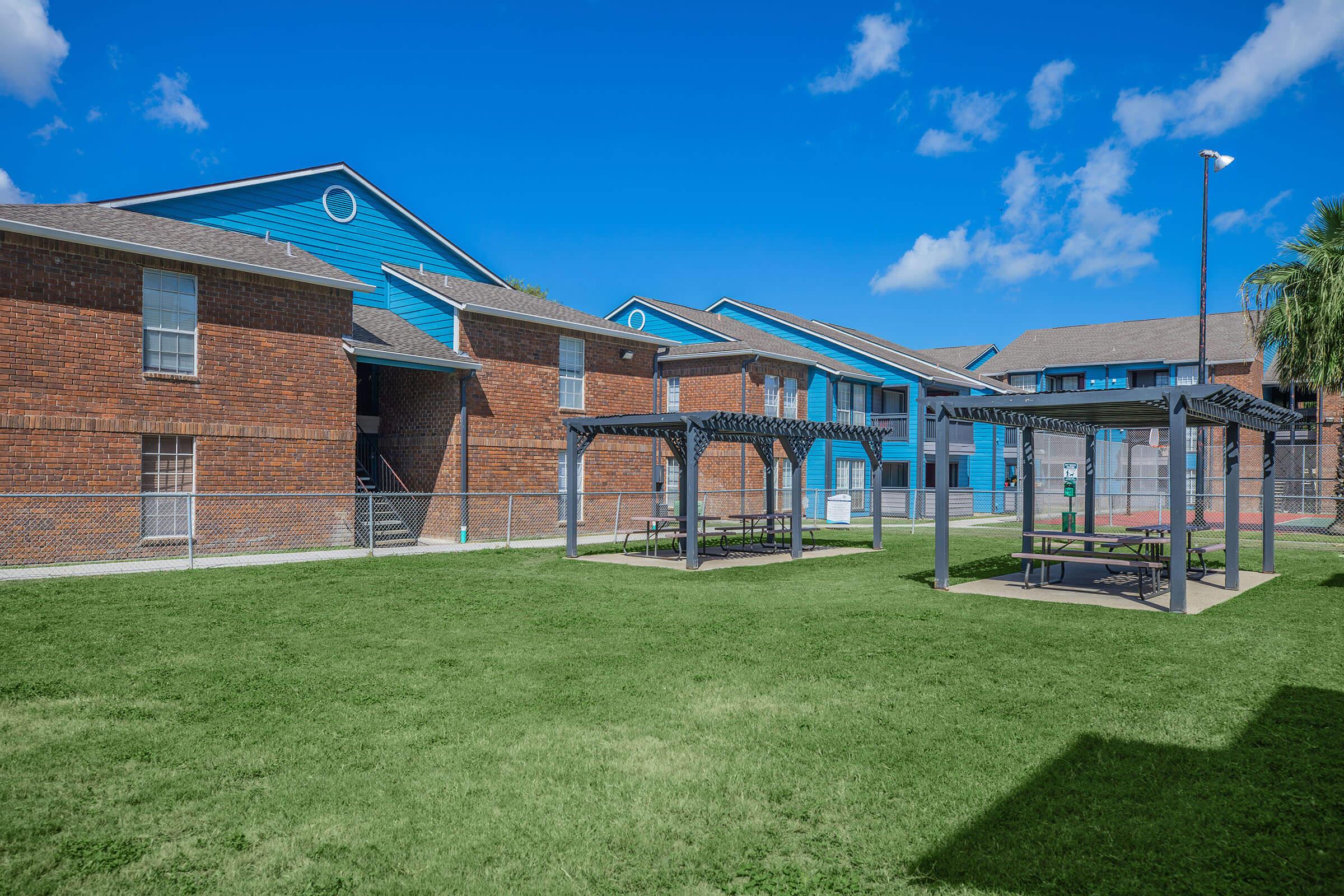 a building with a grassy field