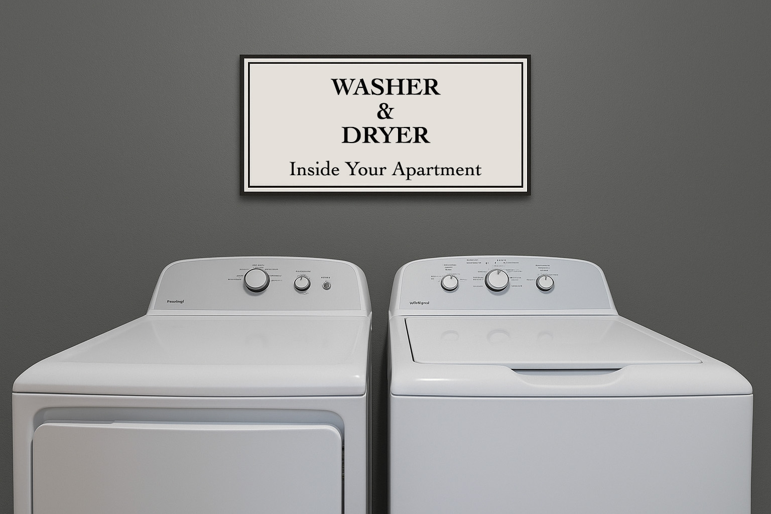 A sign that reads "WASHER & DRYER Inside Your Apartment" is mounted on a gray wall above a set of white laundry appliances, including a washer and dryer side by side, both featuring knobs and dials for control.