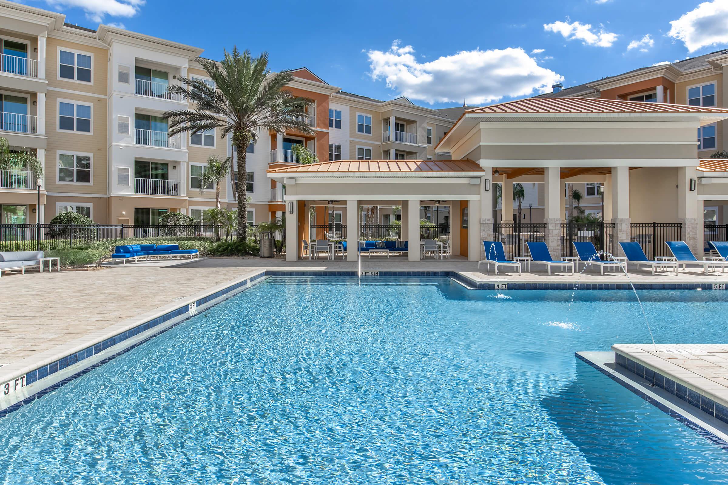 a large pool of water in front of a building