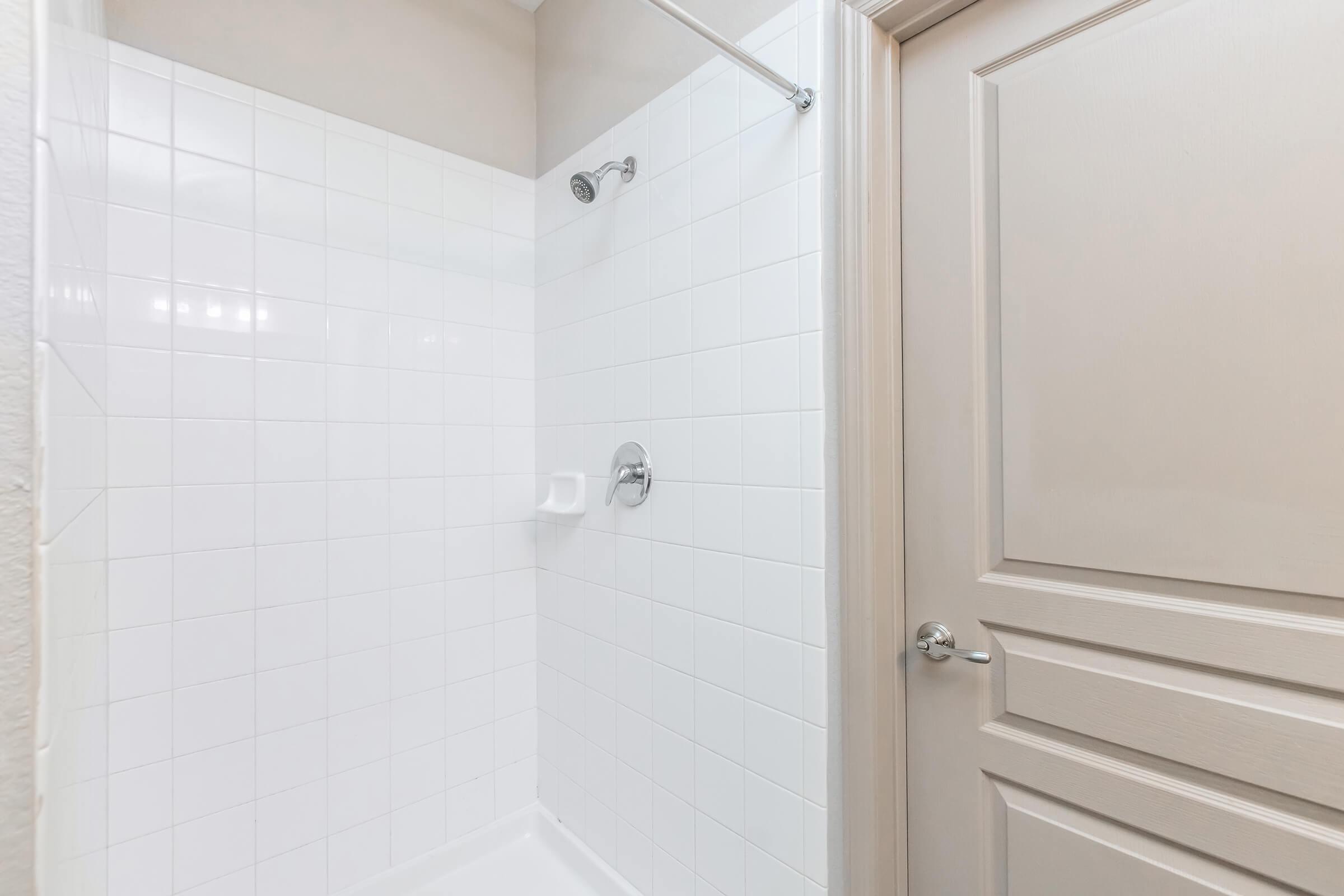 a close up of a shower in a small room