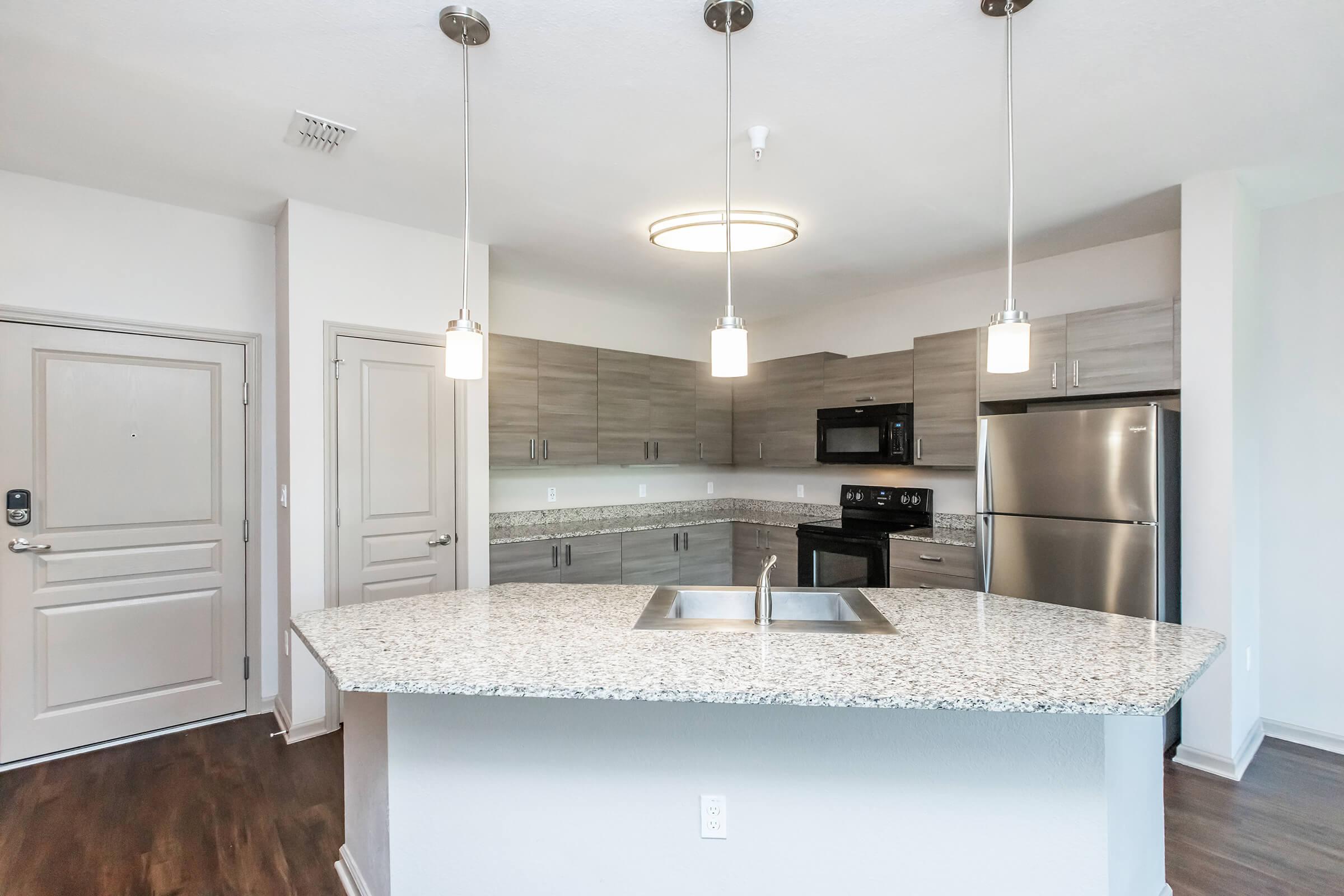 a kitchen with a table in a room