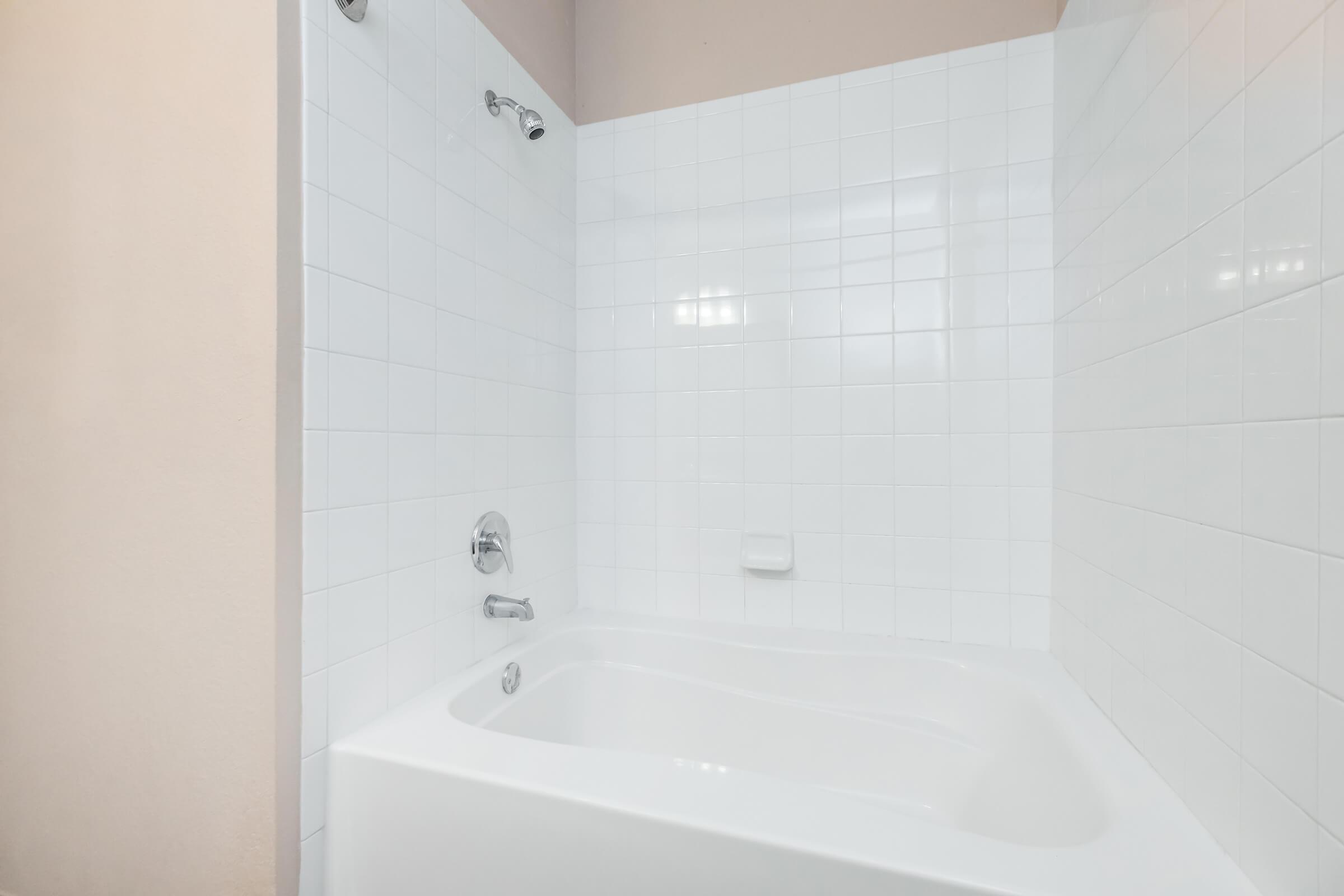 a room that has a sink and a bath tub